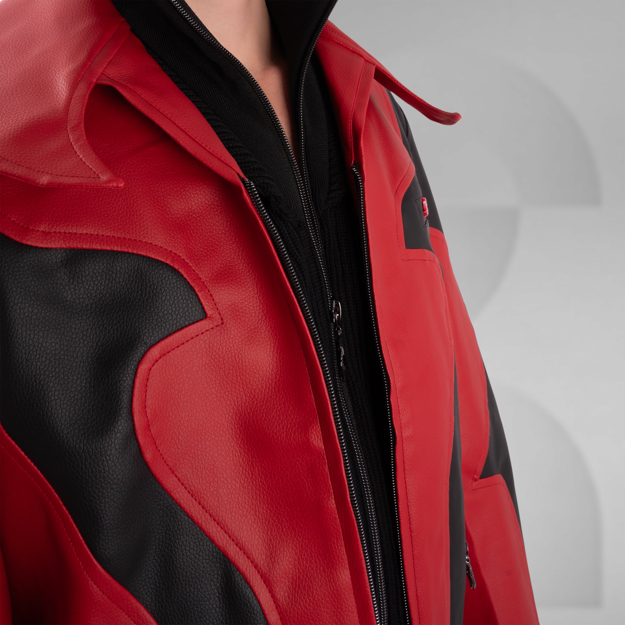 Close-up of a red and black jacket with a blurred background