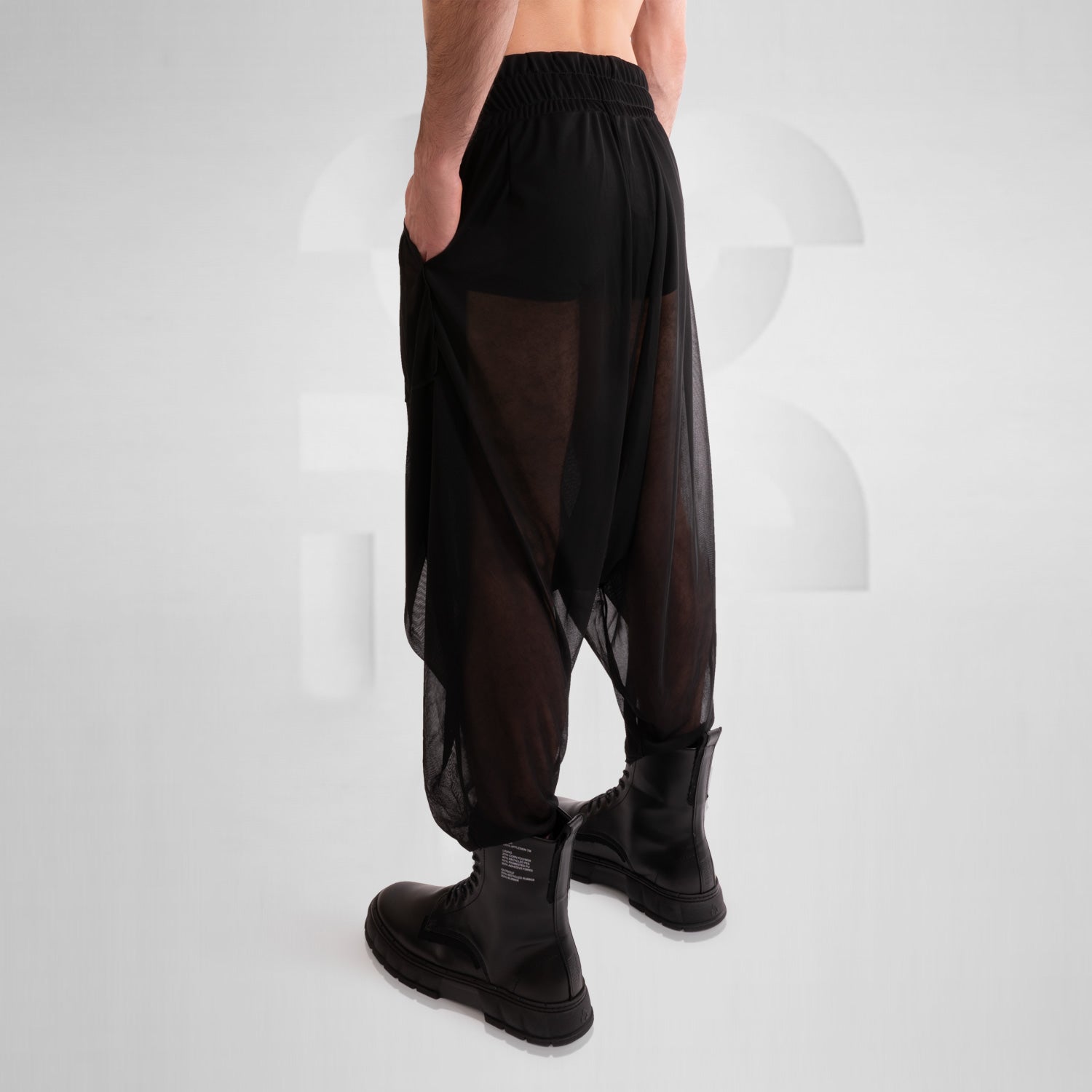 Check out the Avantgarde Mesh Trousers by This is Fred. These trousers redefine clubwear with their innovative design and breathable mesh fabric, ensuring both style and comfort. Perfect for festivals, techno parties, or making a statement on the streets, they bring bold, high-fashion energy to any look. Elevate your style and embrace the avant-garde with these eye-catching trousers.