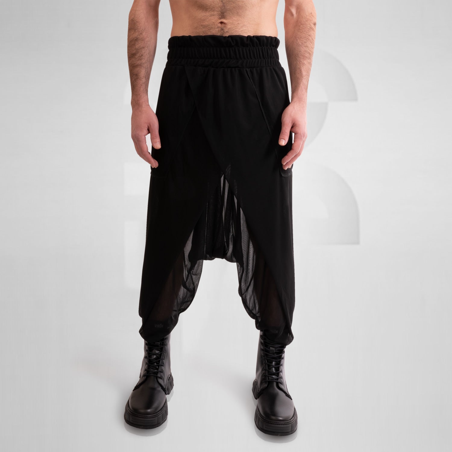 Check out the Avantgarde Mesh Trousers by This is Fred. These trousers redefine clubwear with their innovative design and breathable mesh fabric, ensuring both style and comfort. Perfect for festivals, techno parties, or making a statement on the streets, they bring bold, high-fashion energy to any look. Elevate your style and embrace the avant-garde with these eye-catching trousers.