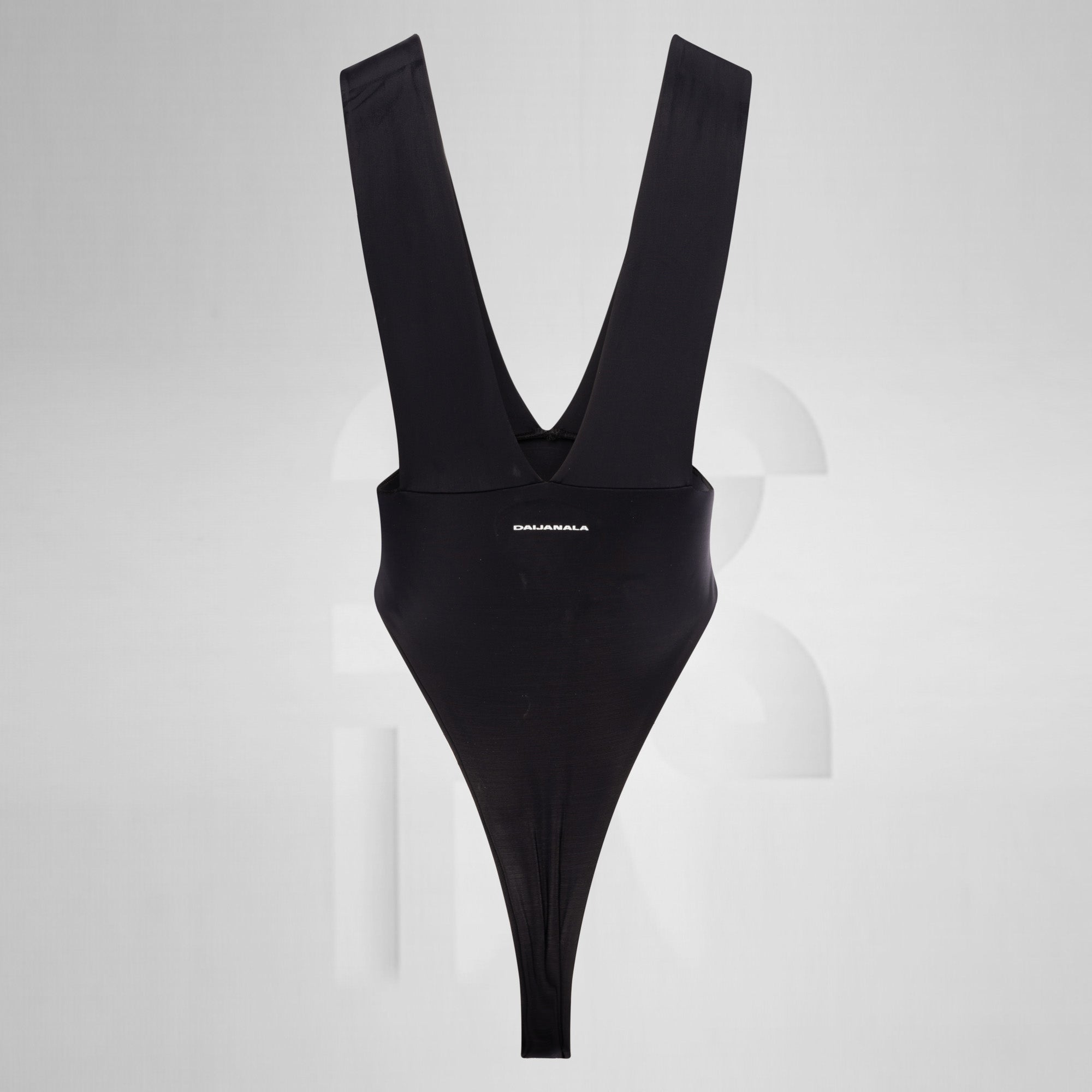 Black swimsuit with a plunging neckline on a gray background