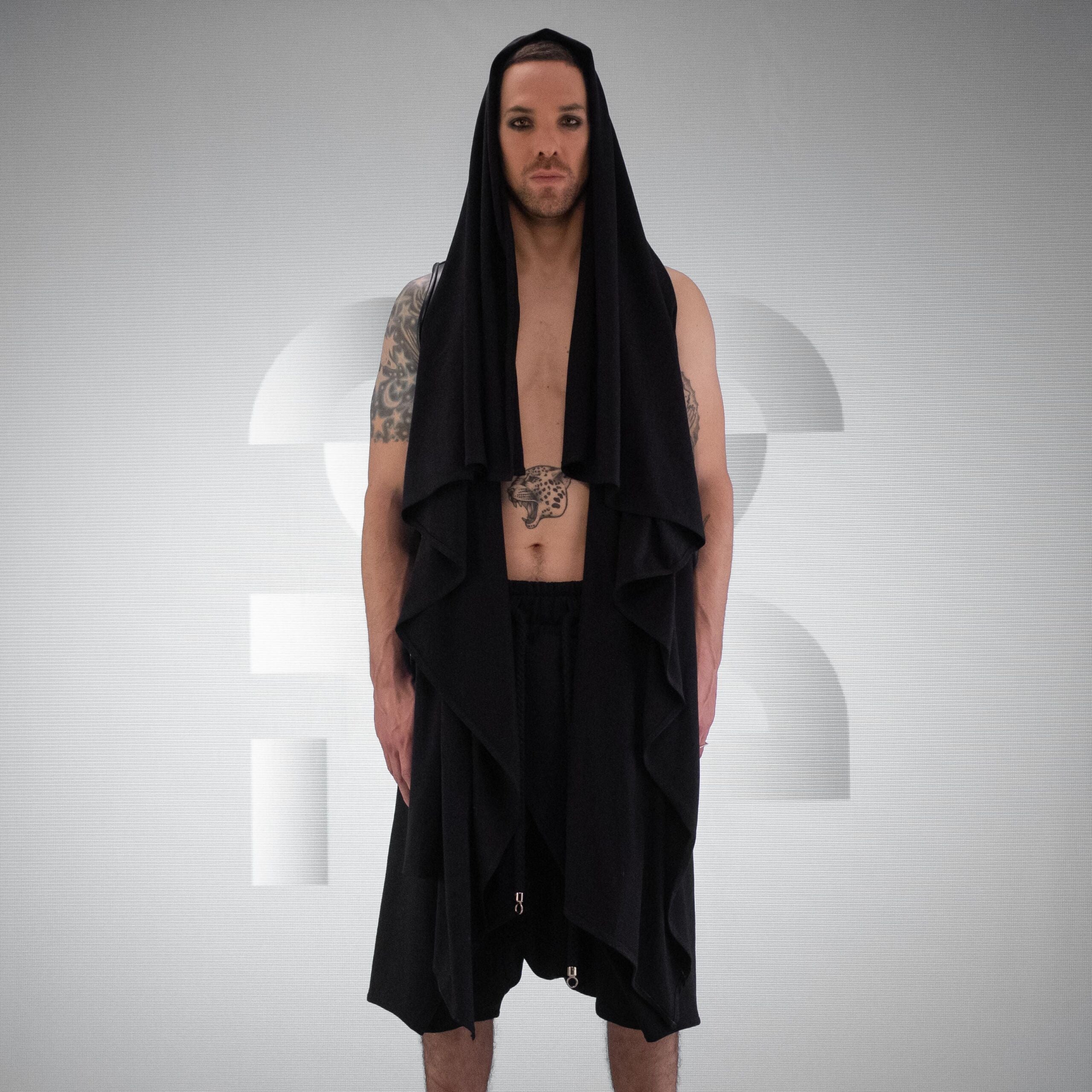 A black Cardigan, with Laser-Cut Geometric Back Design made out of Intricate vegan leather.