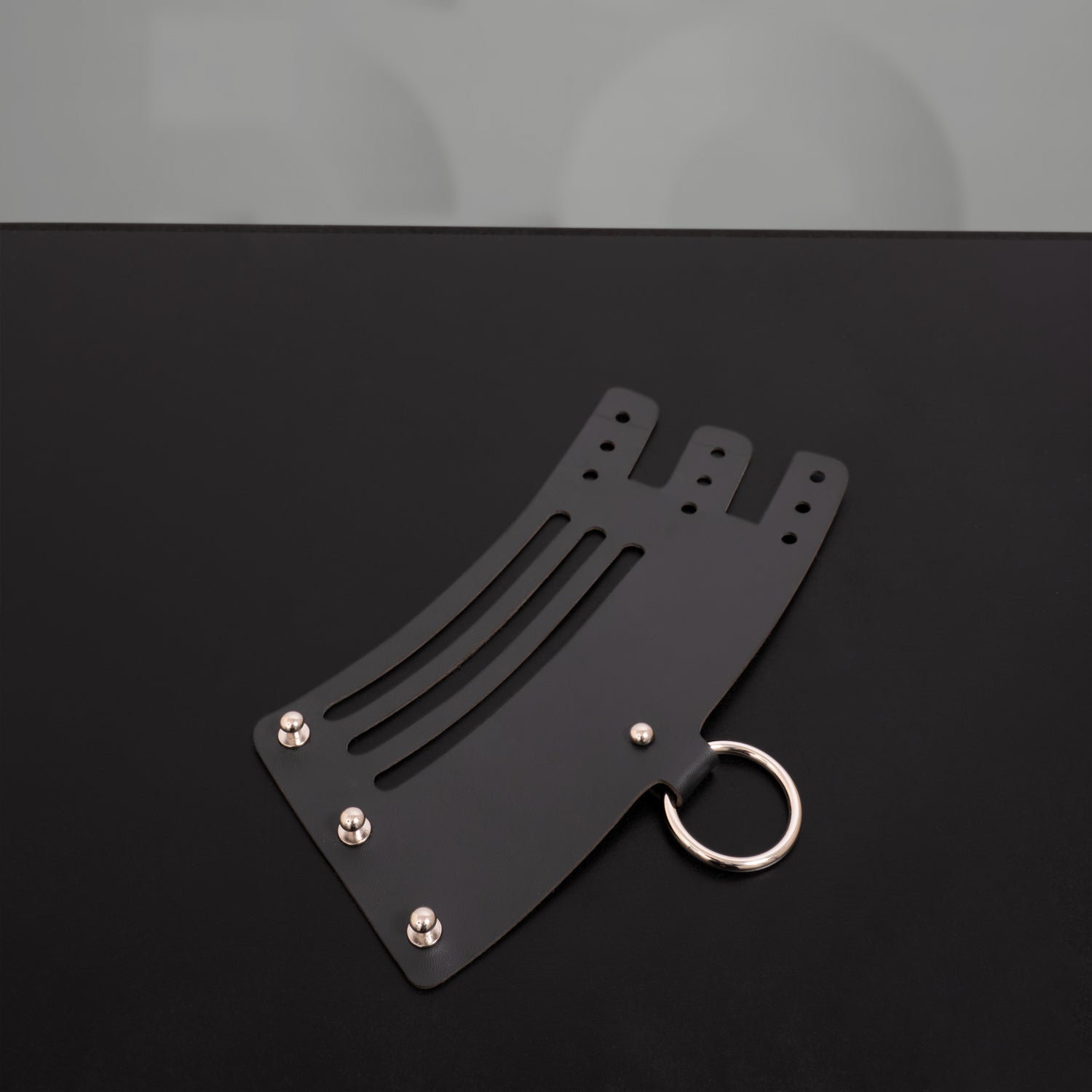Unisex bracelet by Cyberesque that features a bold metal ring and puristic geometric design.