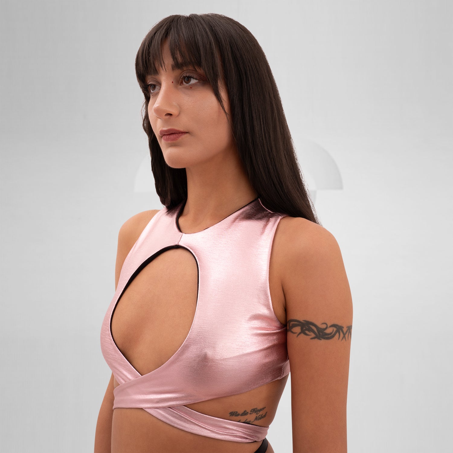 Introducing the Bound Gender-Neutral Foil Top from Berlin designer Nur Hektor. This avant-garde piece features eye-catching foil accents and a bold, wraparound design, making it ideal for festivals and clubwear. Perfect for expressing individuality and embracing a kinky, edgy style, this top captures the essence of Berlin's cutting-edge fashion. Elevate your look and stand out with this unique statement piece!