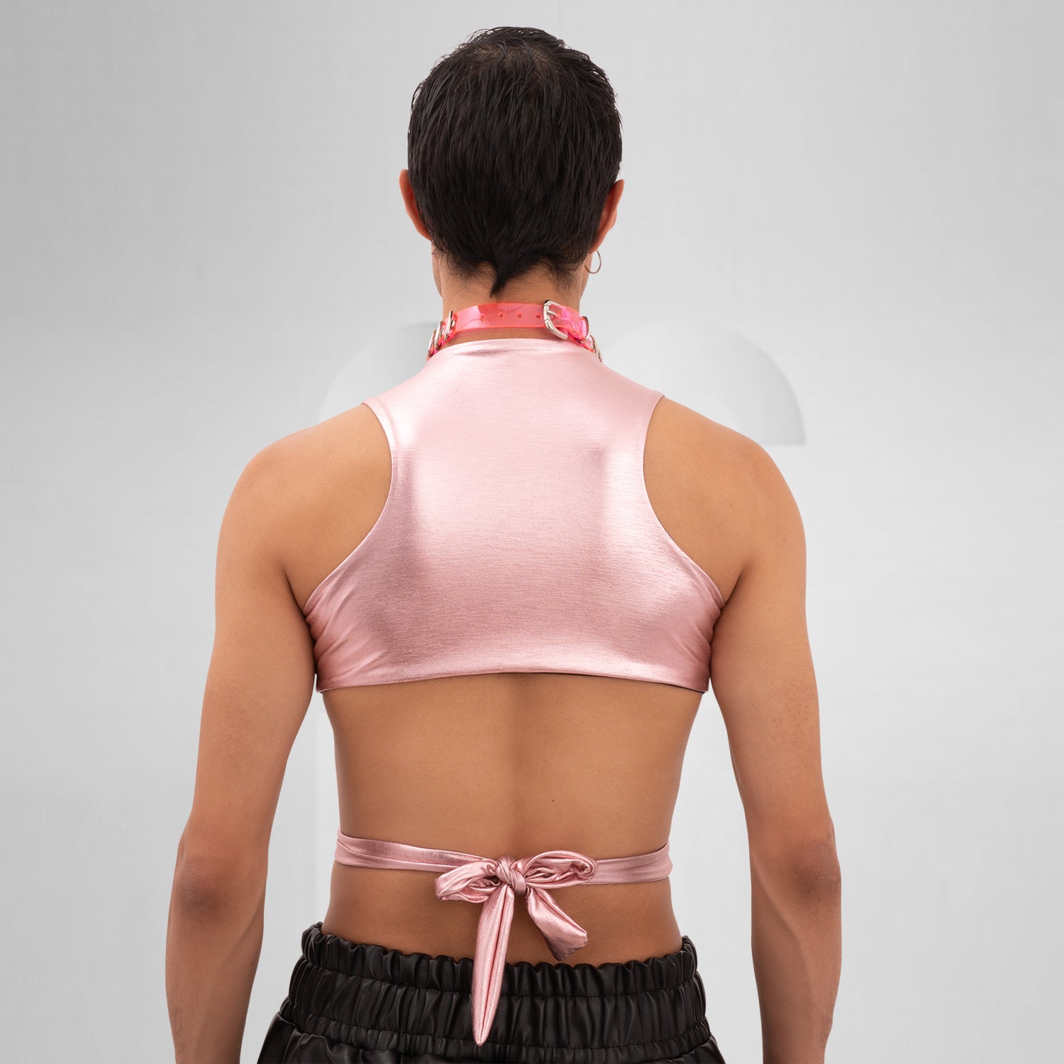 Introducing the Bound Gender-Neutral Foil Top from Berlin designer Nur Hektor. This avant-garde piece features eye-catching foil accents and a bold, wraparound design, making it ideal for festivals and clubwear. Perfect for expressing individuality and embracing a kinky, edgy style, this top captures the essence of Berlin's cutting-edge fashion. Elevate your look and stand out with this unique statement piece!