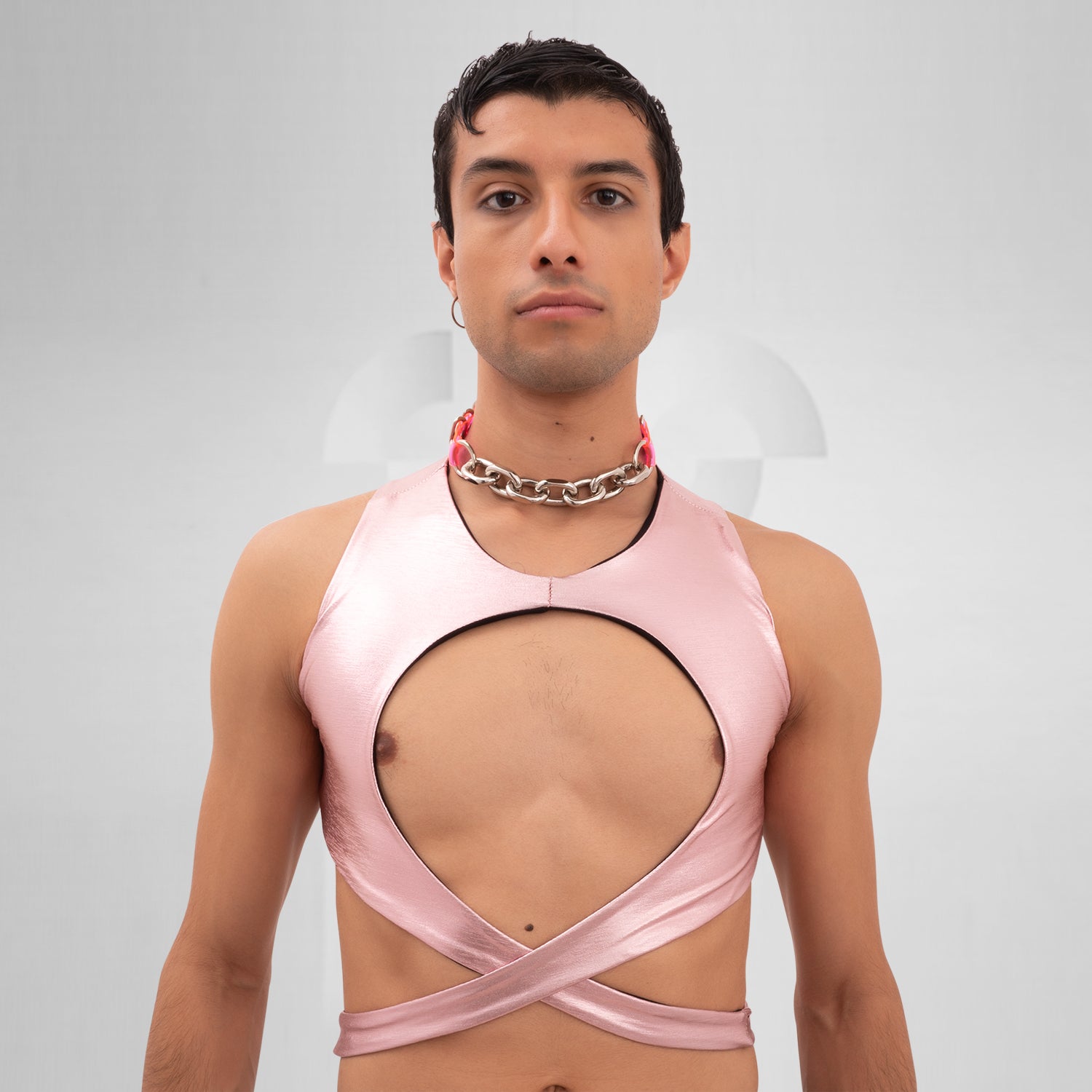 Introducing the Bound Gender-Neutral Foil Top from Berlin designer Nur Hektor. This avant-garde piece features eye-catching foil accents and a bold, wraparound design, making it ideal for festivals and clubwear. Perfect for expressing individuality and embracing a kinky, edgy style, this top captures the essence of Berlin's cutting-edge fashion. Elevate your look and stand out with this unique statement piece!