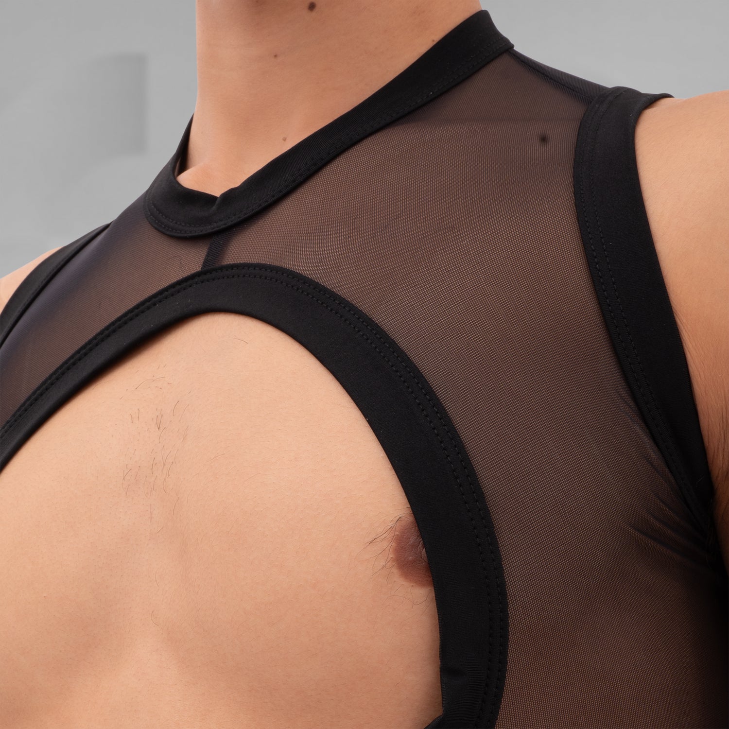 Introducing the Bound Gender-Neutral Mesh Top from Berlin designer Nur Hektor. This avant-garde piece combines sheer mesh with a daring wraparound design, making it perfect for festivals and clubwear. The striking cut-out detail offers a bold yet stylish silhouette, allowing for expressive individuality and a unique fashion statement.