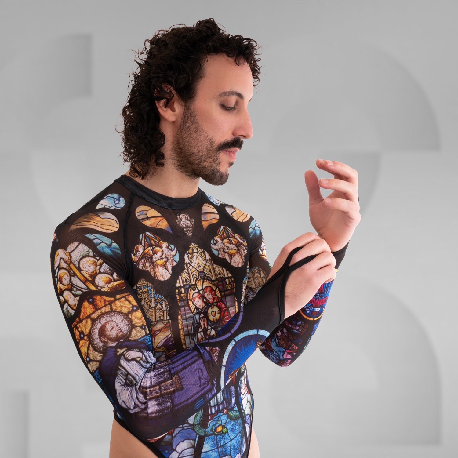 Side view of the artsy yet edgy Church Print Bodysuit with long sleeves and a thong by Effenberger Couture.