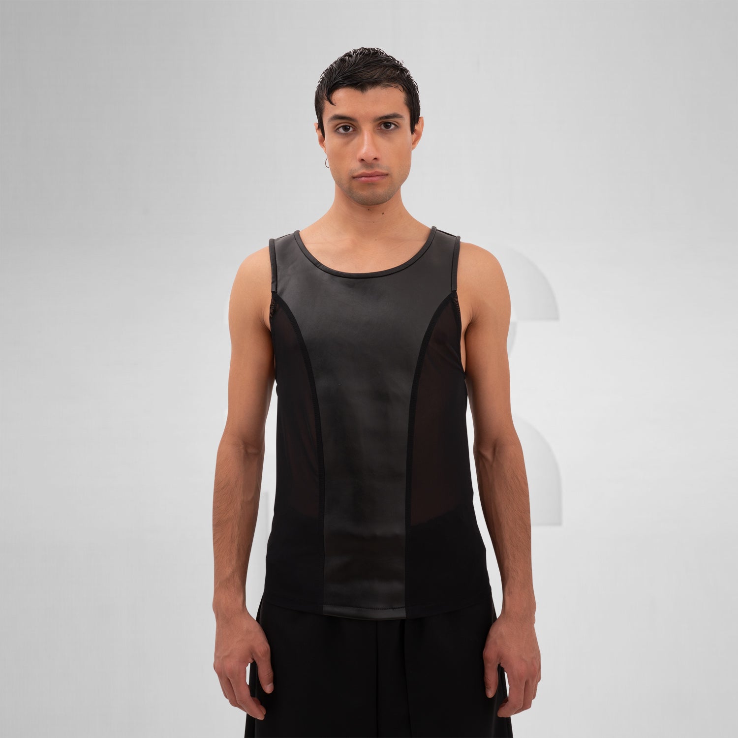 The Cutting Edge Vegan Leather Mesh Tanktop from Cyberesque blends sleek vegan leather with mesh panels for a dynamic look. This tank top offers a modern, edgy style perfect for tribal festivals or avant-garde street fashion. Its minimalist design exudes sophistication, making it an ideal choice for anyone looking to make a bold statement. Wear it to showcase your unique fashion sense with confidence.