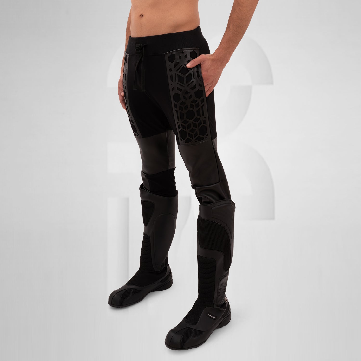 Faux Leather Laser-Cut Jogger Pants feature a unique design that seamlessly blends comfort with edgy style. Equipped with a drawstring waist for an adjustable fit, they provide both functionality and flair. The jogger style also includes practical side patch pockets, making them perfect for any on-the-go lifestyle. Ideal for fashion-forward individual