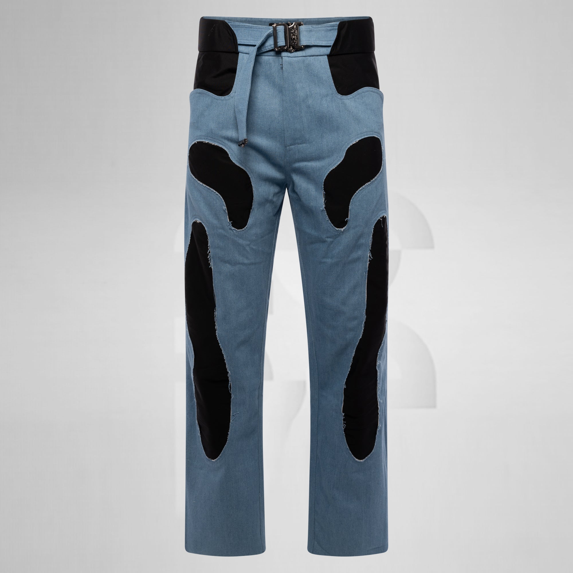 Blue pants with black patches on a light gray background
