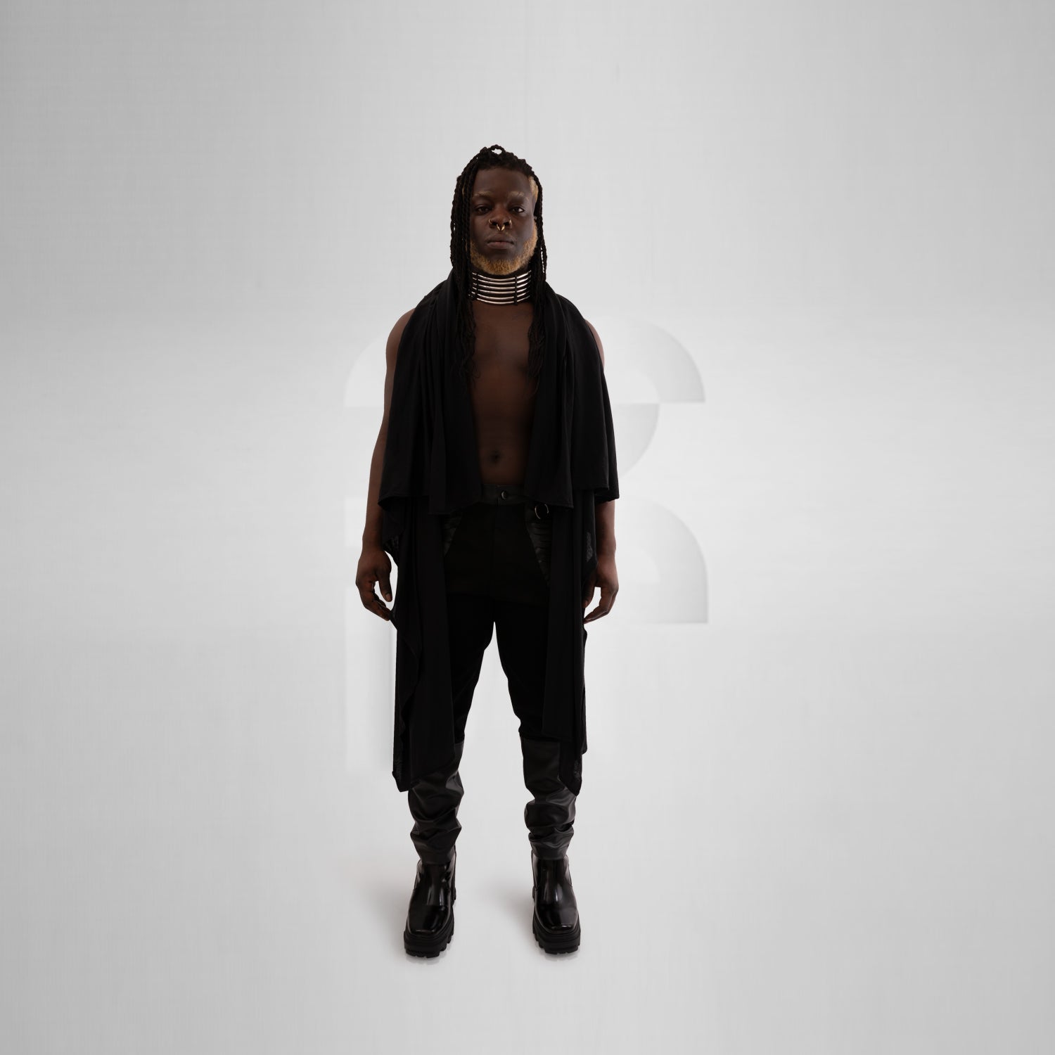 This Berlin festival-inspired ensemble features a faux leather vest with laser cut back details and a trendy jersey hoodie.