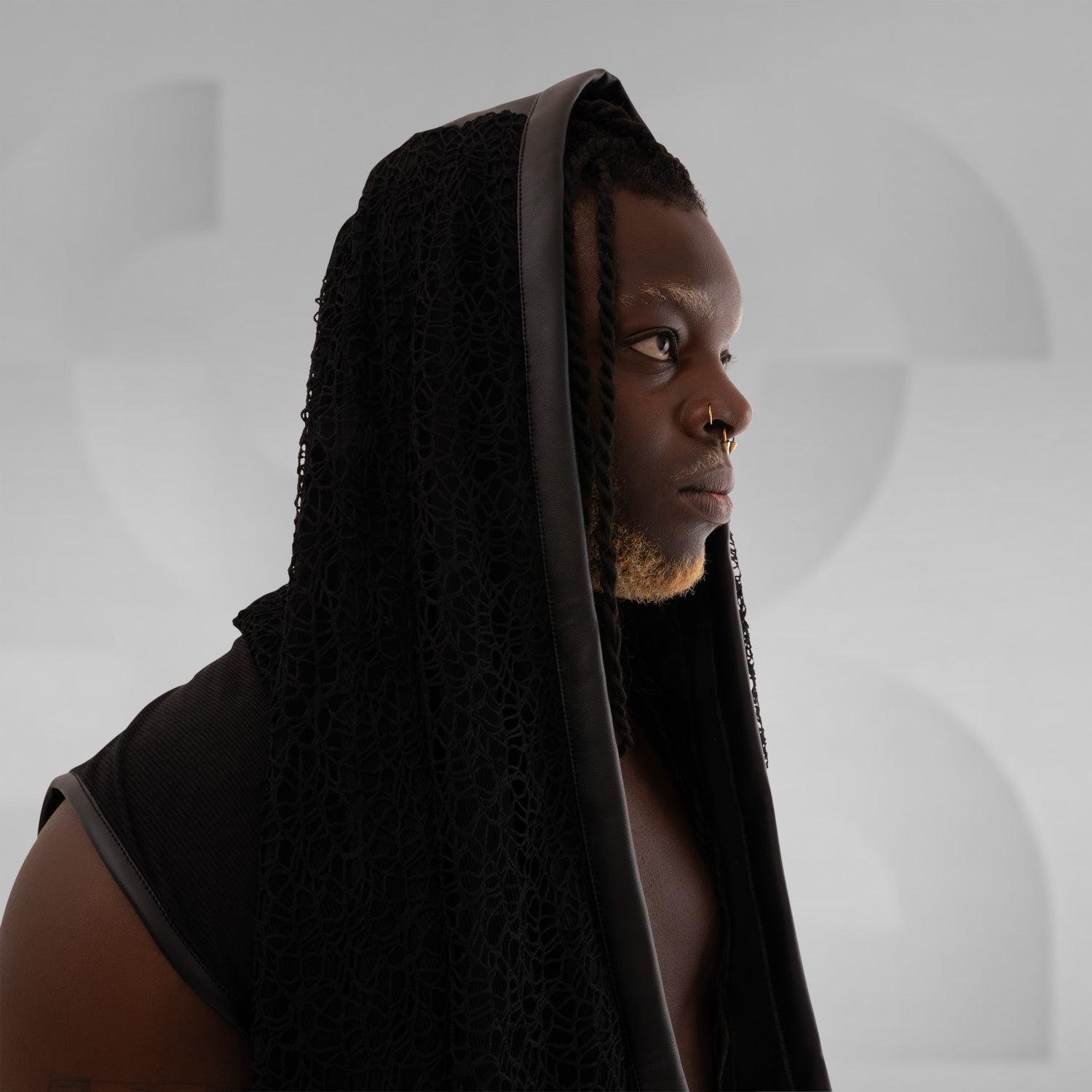 Black knitted hoodie with faux leather details for a trendy and friendly look