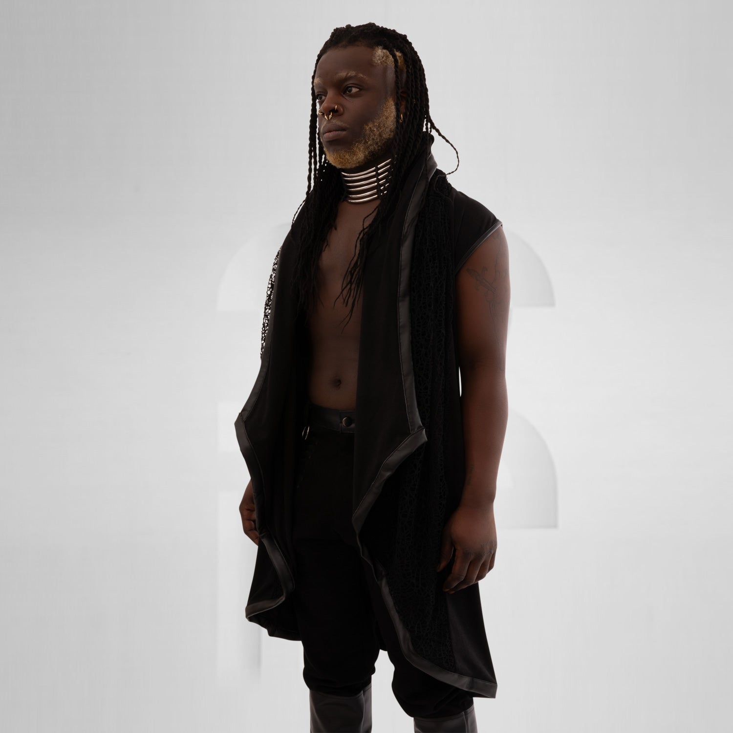 Black knitted hoodie with faux leather details for a trendy and eco-friendly look