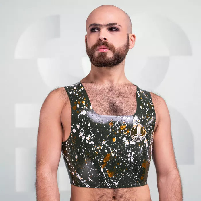 The image features the Latex Splash Cropped Tank Top, showcasing a bold design with splatter patterns in green and contrasting colors. This striking piece offers a modern, edgy look, making it perfect for those who want to make a statement. Its sleek fit highlights the wearer's physique, ideal for both clubwear and performance settings.