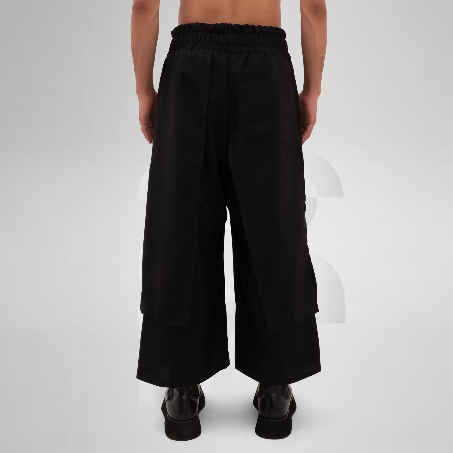 The Layered Bootcut Trousers Mixed from This is Fred showcase a unique design that embodies contemporary London fashion. Featuring a distinctive layered silhouette, these trousers offer a stylish twist to the classic bootcut, making them perfect for both vibrant dance floors and urban street settings. The comfortable fit and sleek black fabric ensure versatility and ease of movement, allowing you to express your individuality effortlessly. Pair them with your favorite boots for a bold, fashion-forward state