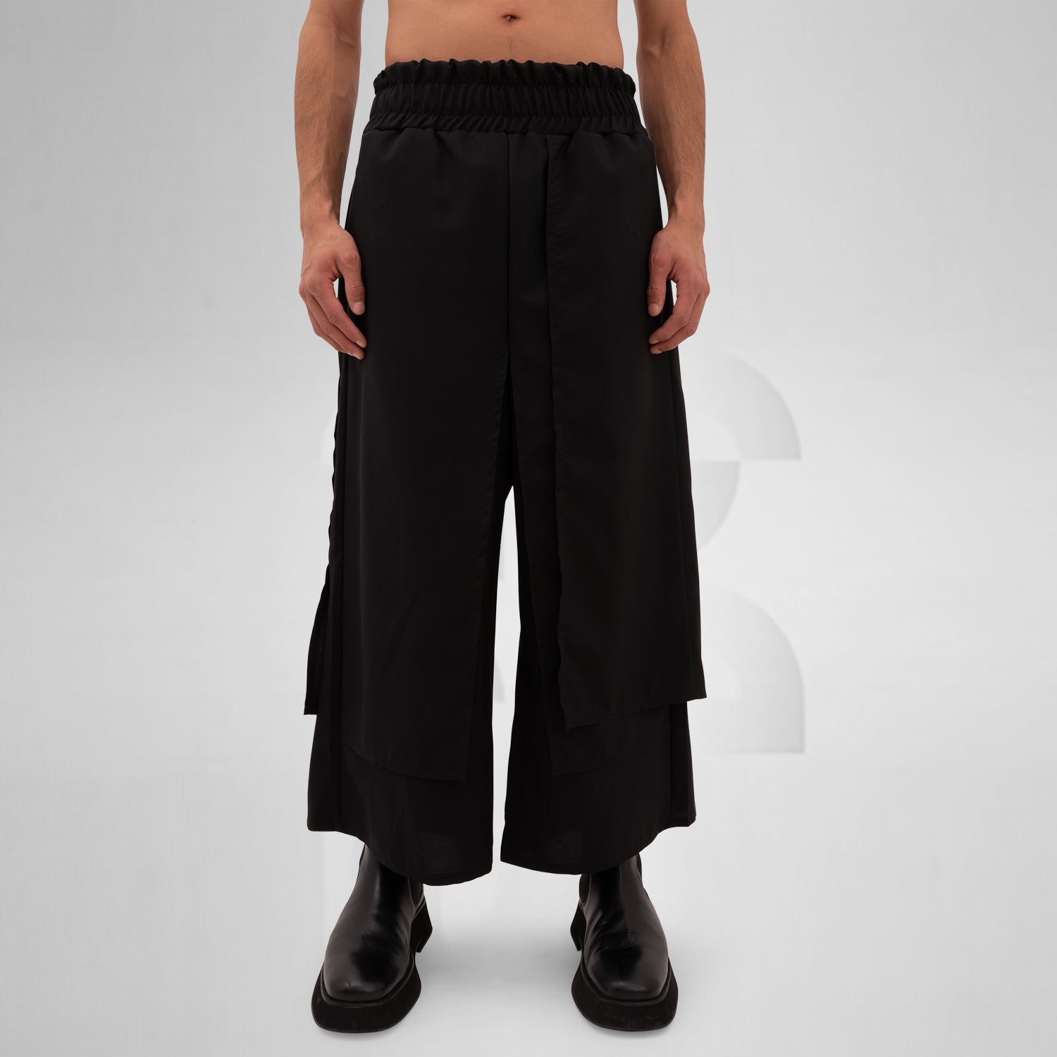 The Layered Bootcut Trousers Mixed from This is Fred showcase a unique design that embodies contemporary London fashion. Featuring a distinctive layered silhouette, these trousers offer a stylish twist to the classic bootcut, making them perfect for both vibrant dance floors and urban street settings. The comfortable fit and sleek black fabric ensure versatility and ease of movement, allowing you to express your individuality effortlessly. Pair them with your favorite boots for a bold, fashion-forward state