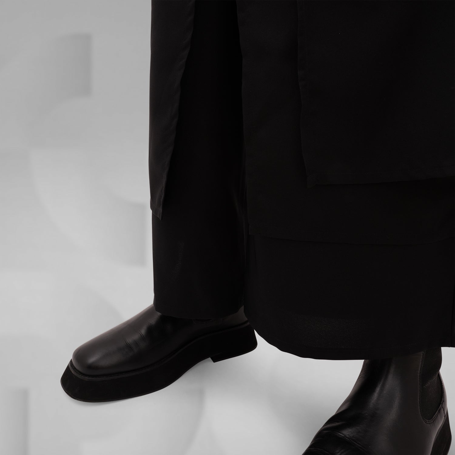 The Layered Bootcut Trousers Mixed from This is Fred showcase a unique design that embodies contemporary London fashion. Featuring a distinctive layered silhouette, these trousers offer a stylish twist to the classic bootcut, making them perfect for both vibrant dance floors and urban street settings. The comfortable fit and sleek black fabric ensure versatility and ease of movement, allowing you to express your individuality effortlessly. Pair them with your favorite boots for a bold, fashion-forward state