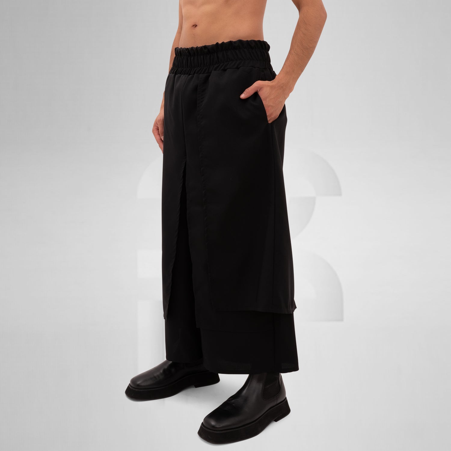 The Layered Bootcut Trousers Mixed from This is Fred showcase a unique design that embodies contemporary London fashion. Featuring a distinctive layered silhouette, these trousers offer a stylish twist to the classic bootcut, making them perfect for both vibrant dance floors and urban street settings. The comfortable fit and sleek black fabric ensure versatility and ease of movement, allowing you to express your individuality effortlessly. Pair them with your favorite boots for a bold, fashion-forward state