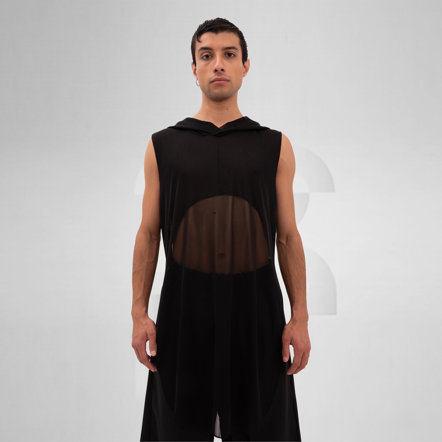 The Mesh Avant-Garde Shirt with Hood from This is Fred offers a bold and innovative design that stands out in any fashion landscape. This unique piece features a lightweight mesh fabric that drapes beautifully, providing both comfort and a striking aesthetic. The hood adds an edgy twist, making it perfect for the techno dance floor or as a statement piece for your street style.