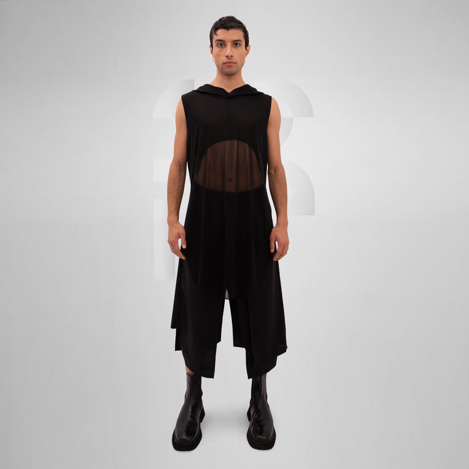 The Mesh Avant-Garde Shirt with Hood from This is Fred offers a bold and innovative design that stands out in any fashion landscape. This unique piece features a lightweight mesh fabric that drapes beautifully, providing both comfort and a striking aesthetic. The hood adds an edgy twist, making it perfect for the techno dance floor or as a statement piece for your street style.