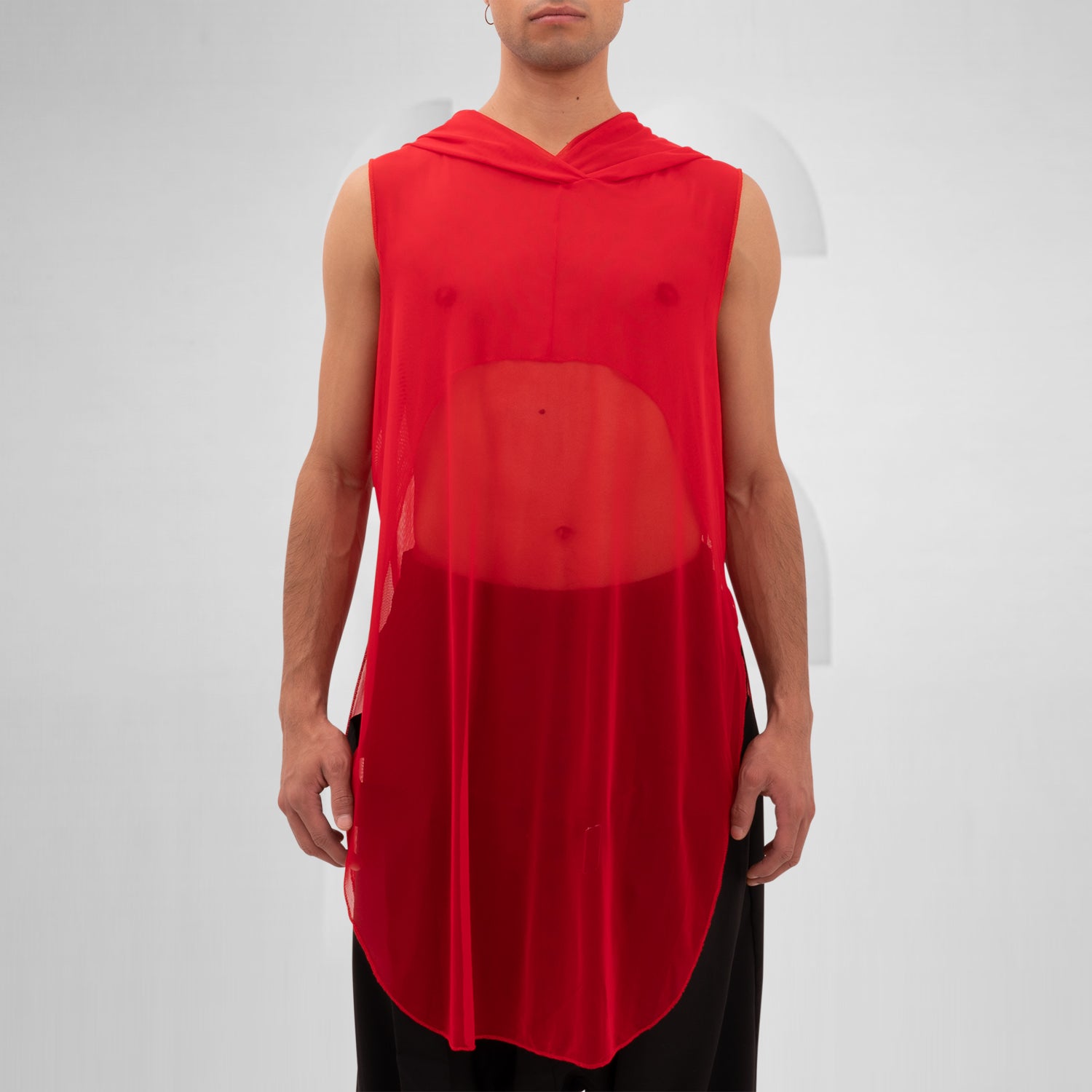 The Mesh Avant-Garde Shirt with Hood from This is Fred offers a bold and innovative design that stands out in any fashion landscape. This unique piece features a lightweight mesh fabric that drapes beautifully, providing both comfort and a striking aesthetic. The hood adds an edgy twist, making it perfect for the techno dance floor or as a statement piece for your street style.