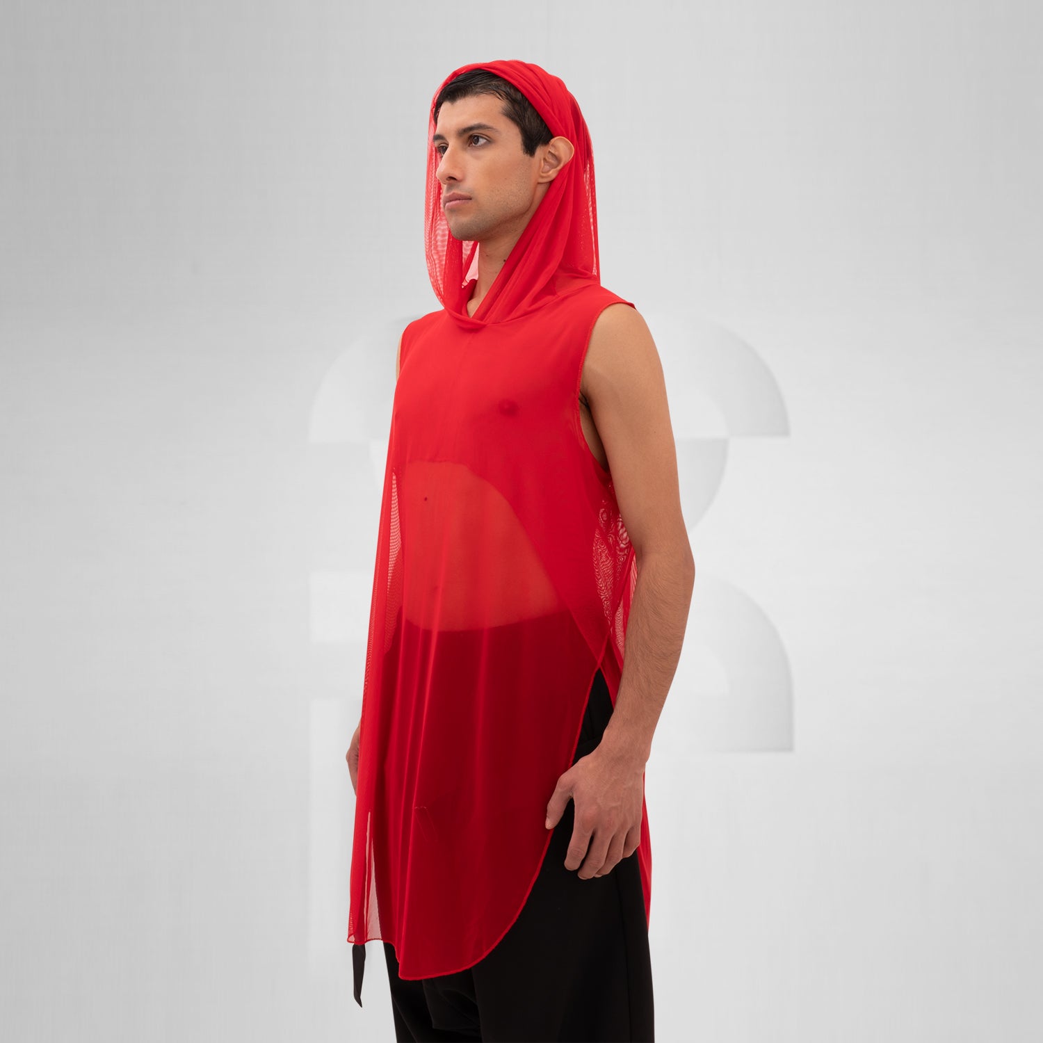 The Mesh Avant-Garde Shirt with Hood from This is Fred offers a bold and innovative design that stands out in any fashion landscape. This unique piece features a lightweight mesh fabric that drapes beautifully, providing both comfort and a striking aesthetic. The hood adds an edgy twist, making it perfect for the techno dance floor or as a statement piece for your street style.