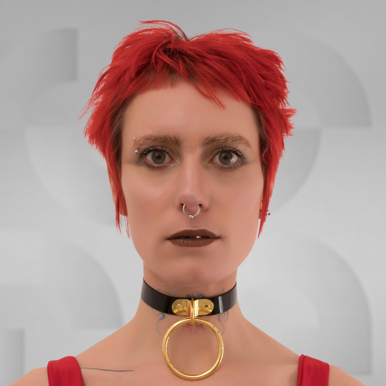 A close-up of the Minimalist Black PVC Choker from Miss Overdose, showcasing its bold oversized ring in gold. The choker, crafted from sleek leather, embodies a blend of elegance and playful kink, perfect for clubwear, adding a striking touch to any outfit.