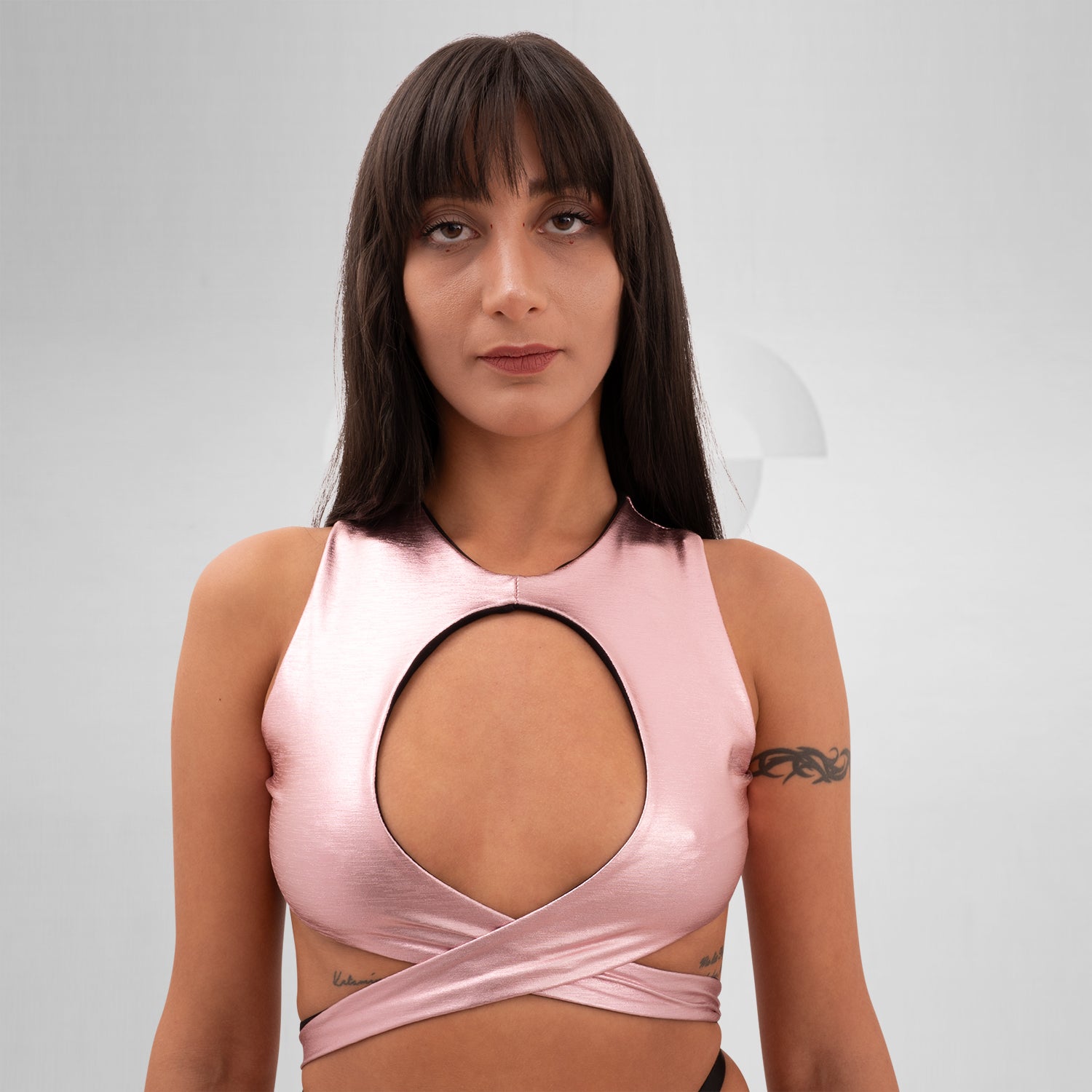 Introducing the Bound Gender-Neutral Foil Top from Berlin designer Nur Hektor. This avant-garde piece features eye-catching foil accents and a bold, wraparound design, making it ideal for festivals and clubwear. Perfect for expressing individuality and embracing a kinky, edgy style, this top captures the essence of Berlin's cutting-edge fashion. Elevate your look and stand out with this unique statement piece!