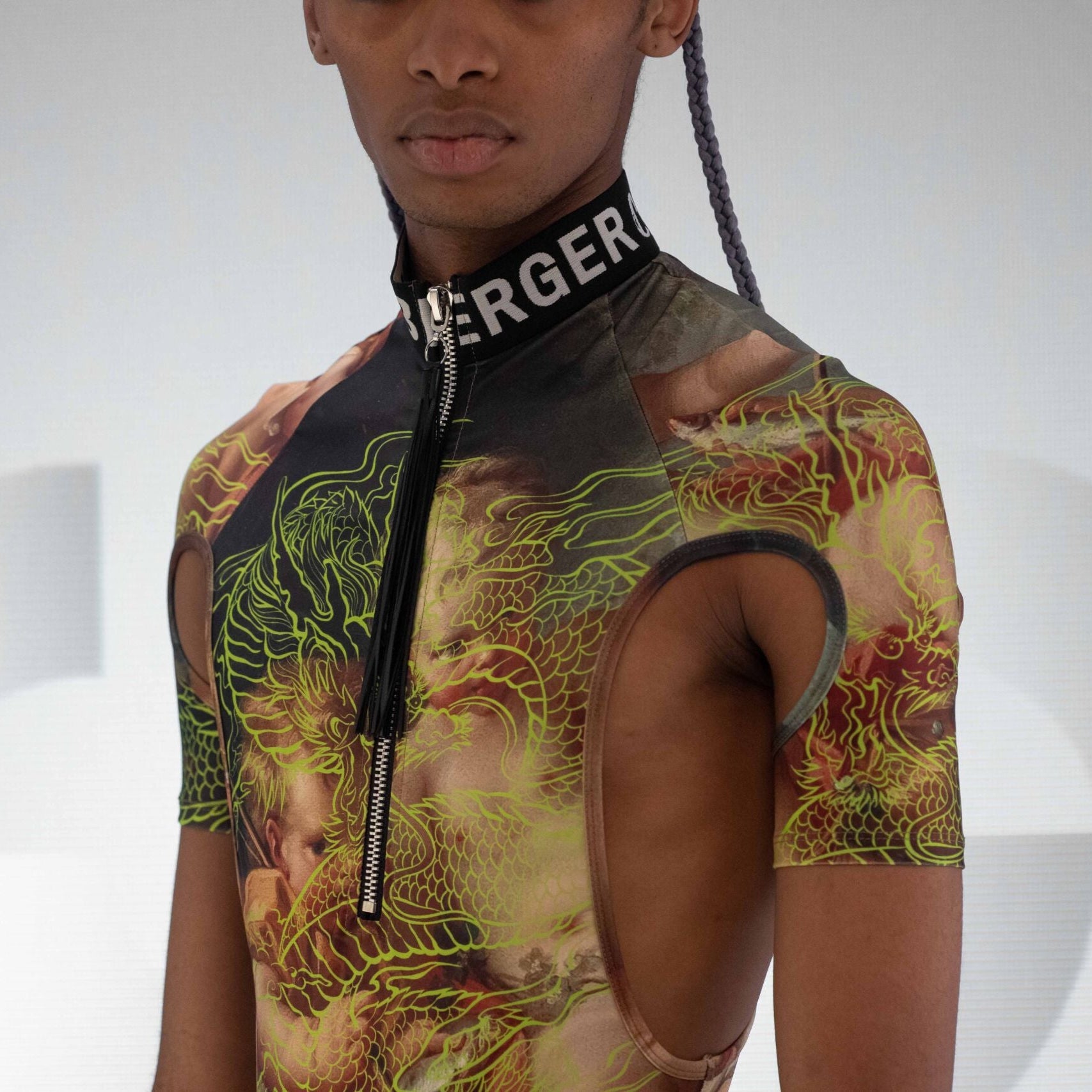 Detail view of the igniting Neon Dragon Bodysuit with high neck and a thong by Effenberger Couture.