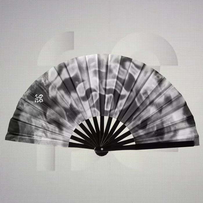 The Printed Smoky Dance Floor Fan from The Code features an exquisite design that blends sleek monochrome tones with a mesmerizing smoky pattern. This striking fan not only offers a refreshing breeze as you dance but also serves as a bold accessory that enhances any outfit. Lightweight and easy to carry, it’s an essential companion for your nights out, allowing you to express your individuality while keeping cool. Perfect for those who appreciate the fusion of style and functionality, this fan is a must-hav