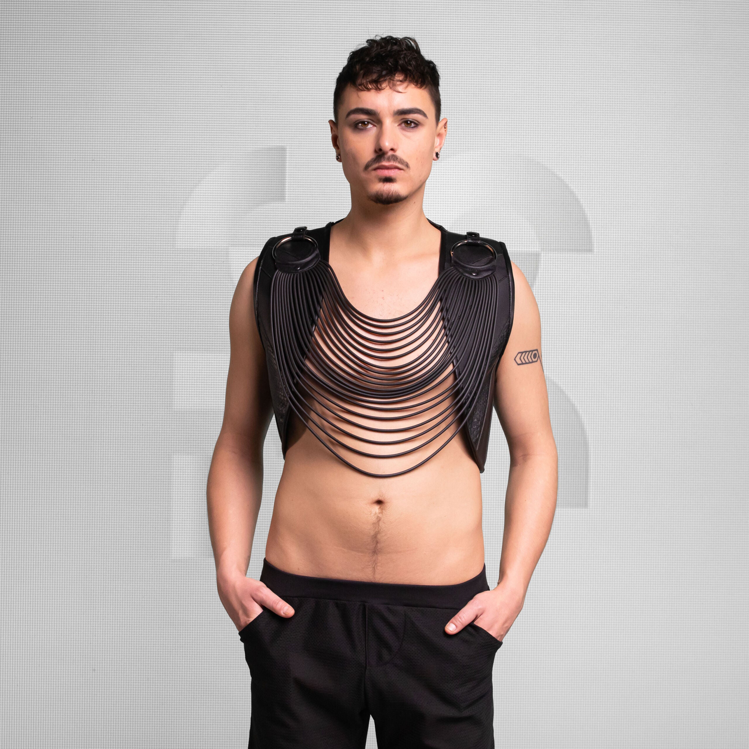 Enigmatic Vest with Rubber Detail, made of faux leather.
