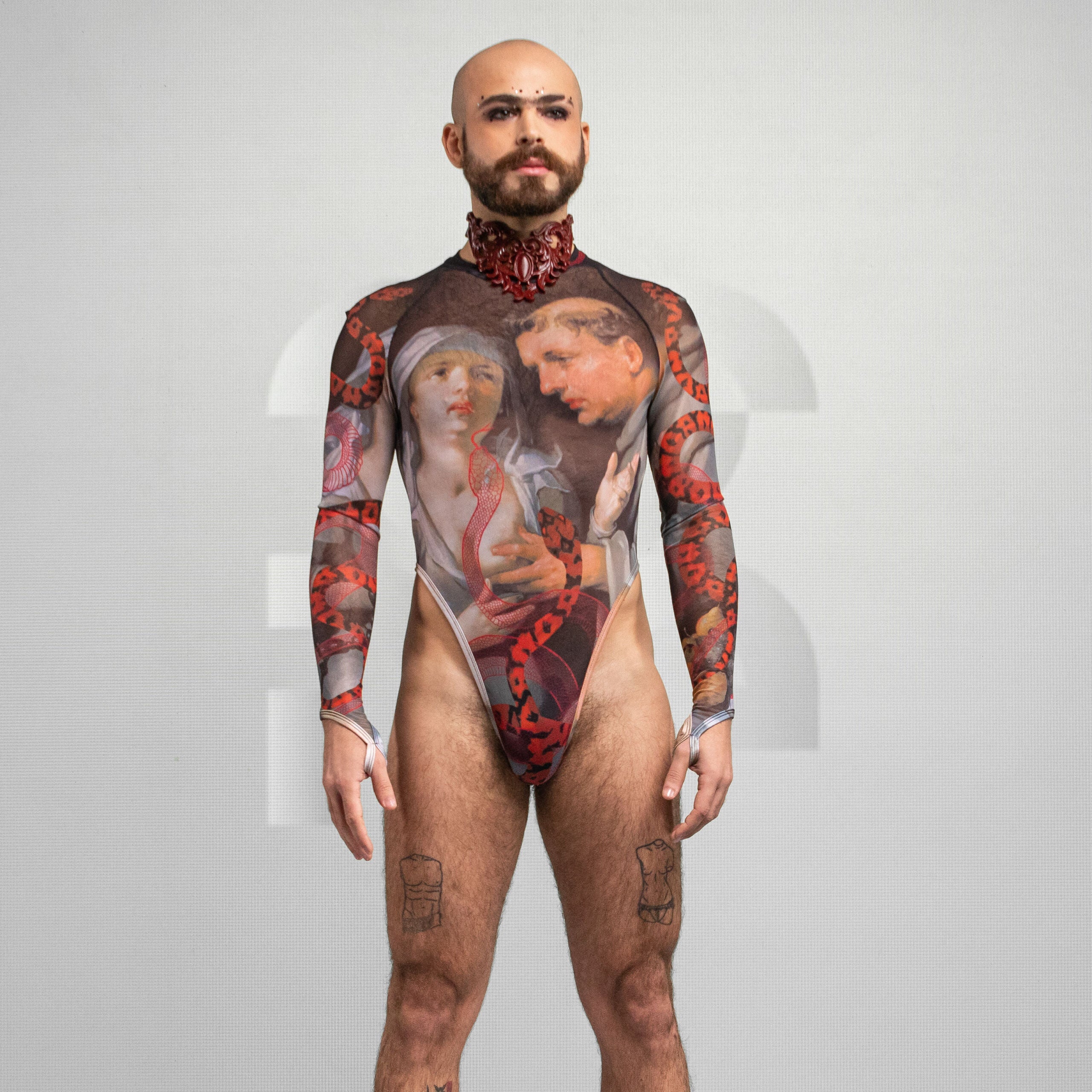 Front view of the artsy yet edgy Serpent Print Bodysuit with long sleeves and a thong by Effenberger Couture.