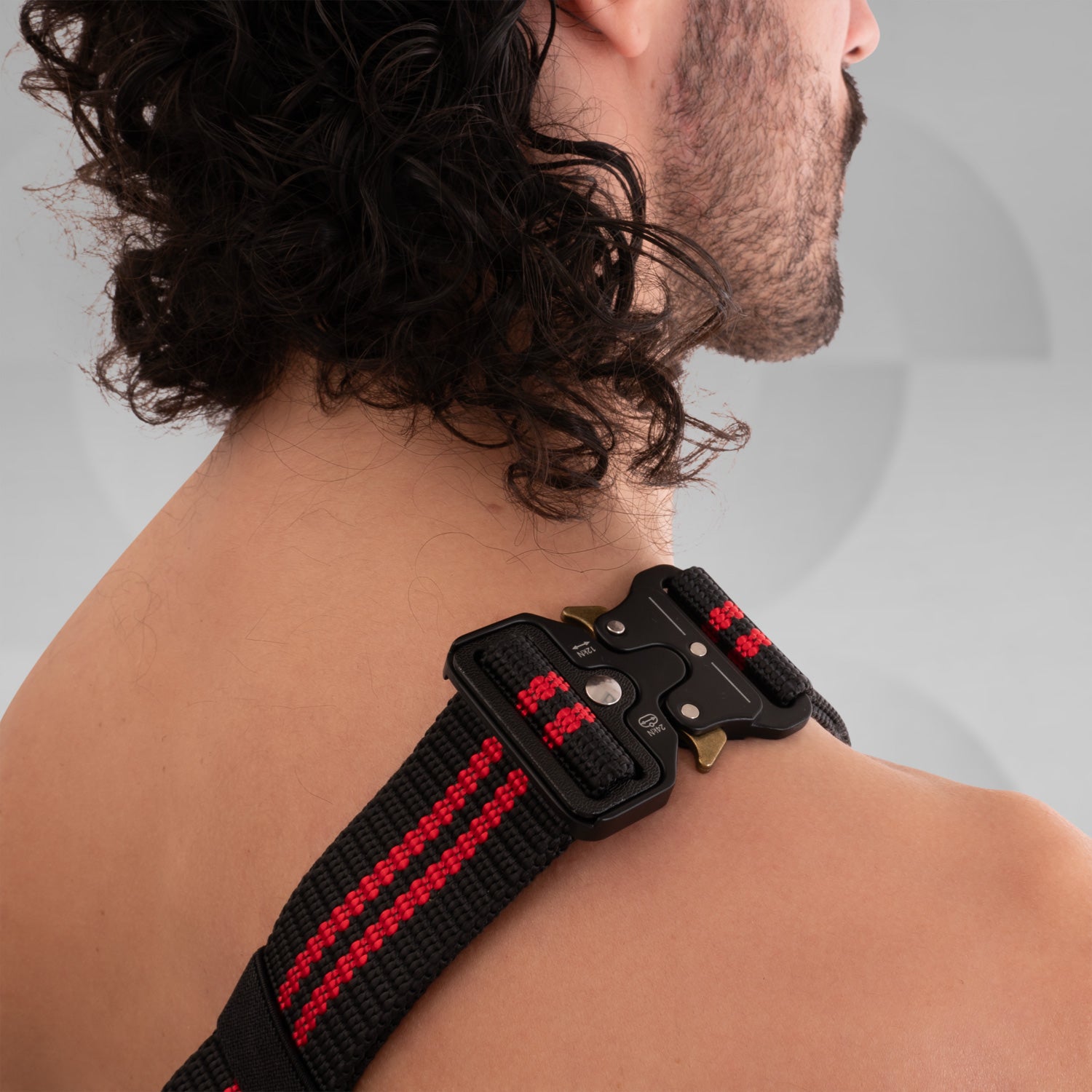 The image features a stylish Suitcase Crossbody Bag in a distinctive black design. This trendy bag is worn over the shoulder, offering a modern and functional look. Its sleek casing and practical compartments make it ideal for those who appreciate both fashion and utility while on the go.