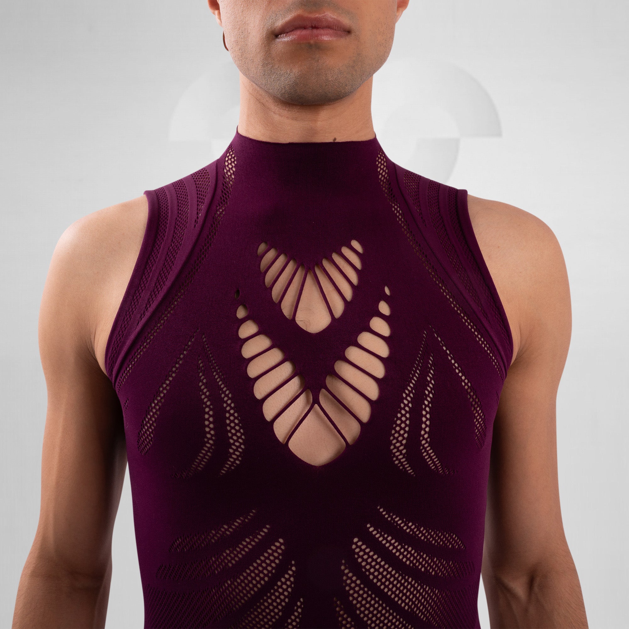 Purple sleeveless top with cut-out design on a plain background