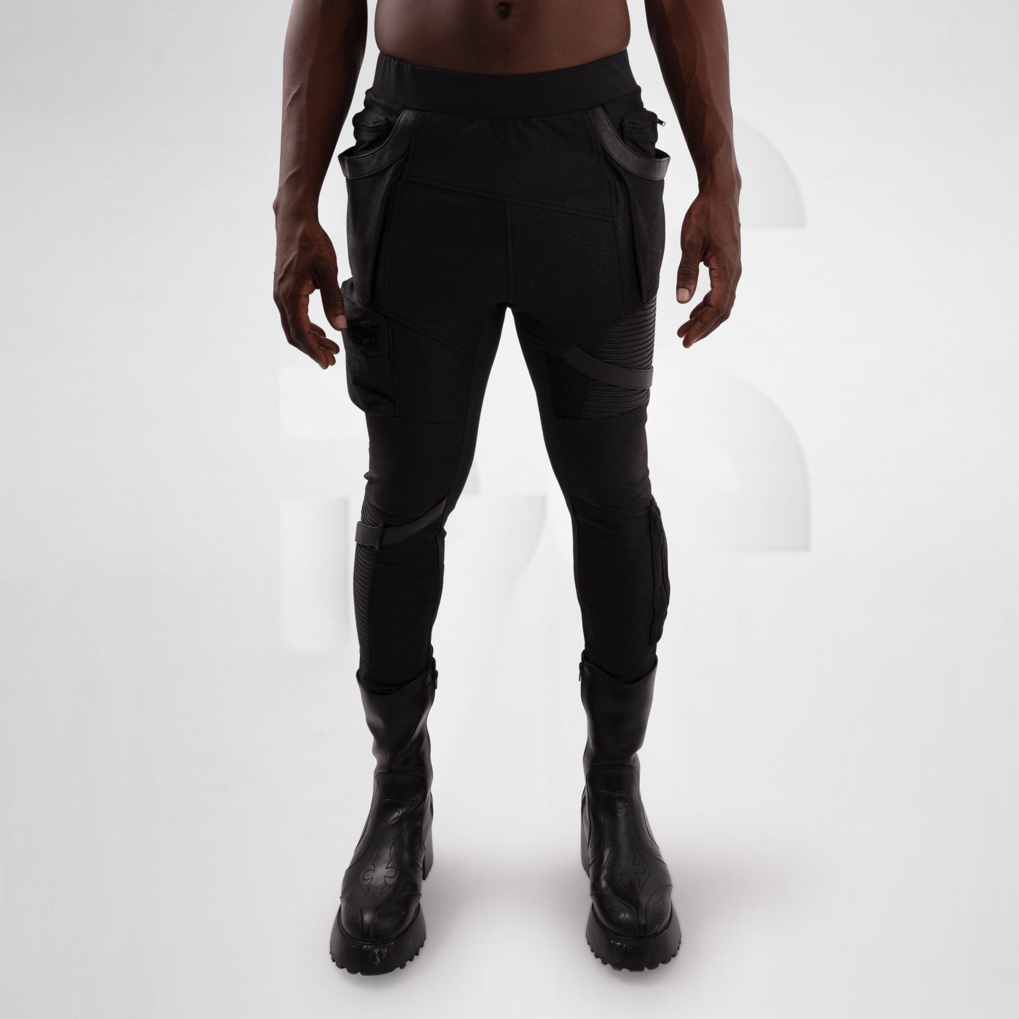 Person wearing black tactical pants with cargo pockets on a white background