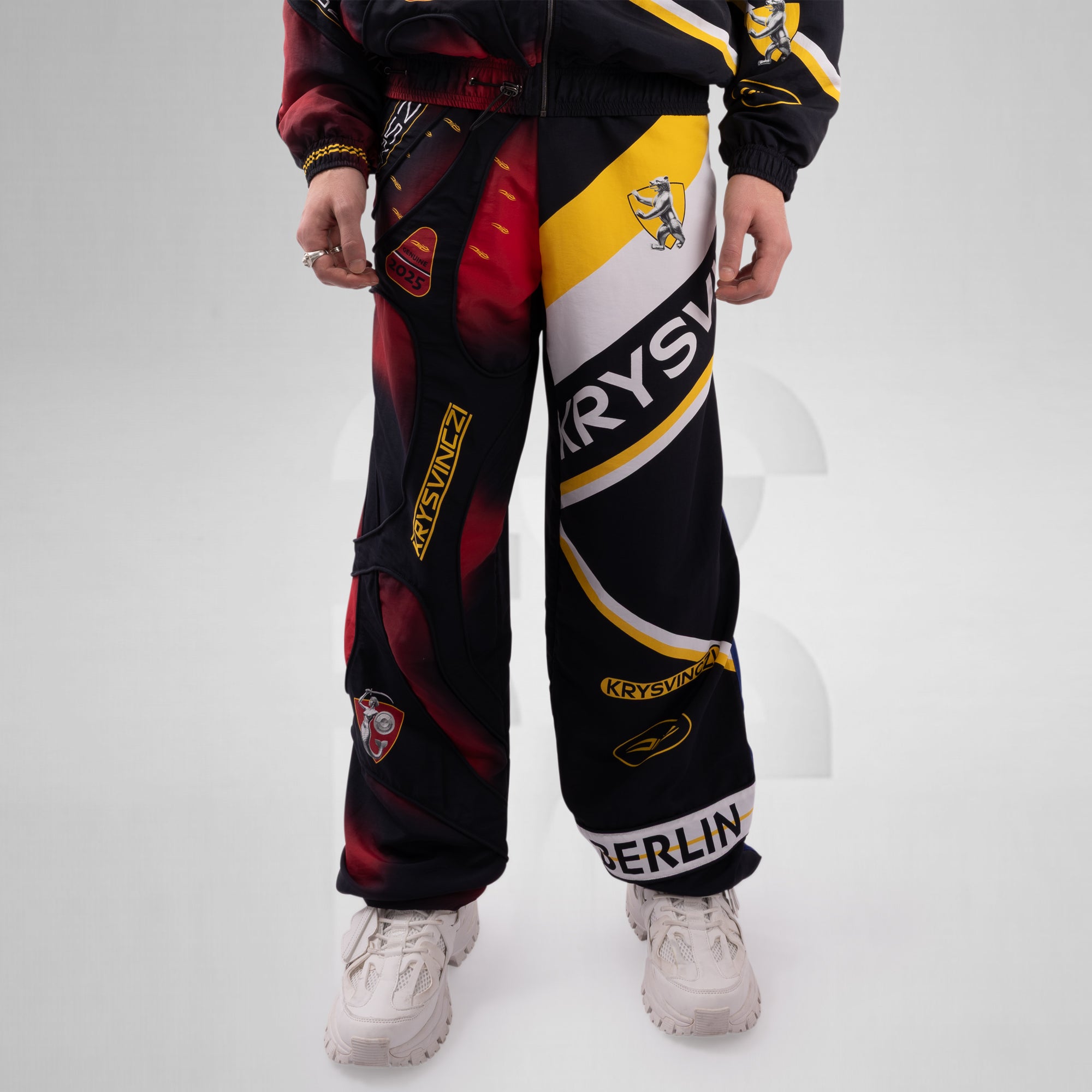 Colorful pants with brand logos on a white background