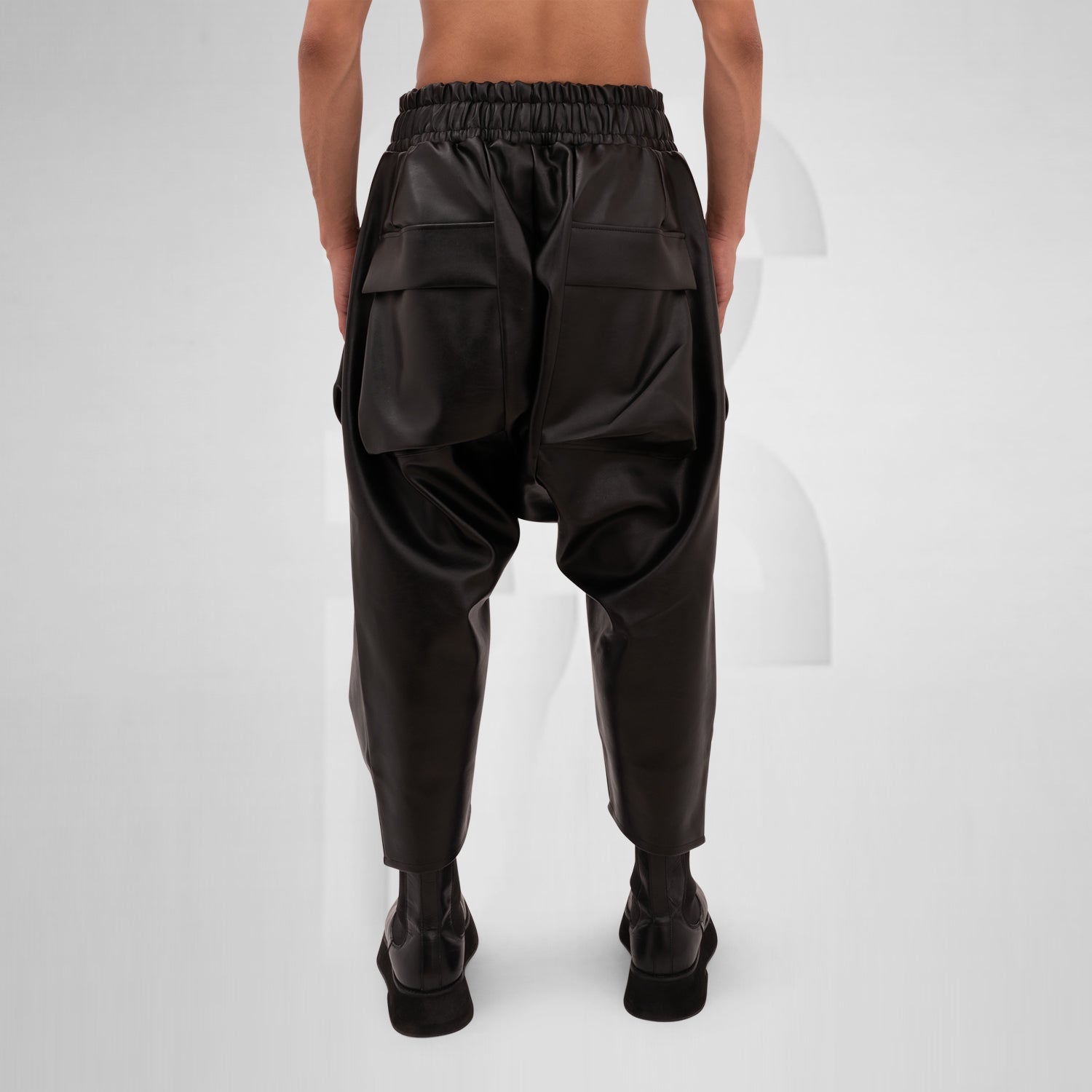 The Vegan Leather Balloon Trousers from This is Fred feature a bold and modern silhouette that redefines contemporary style. Crafted from high-quality vegan leather, these trousers combine luxury with sustainability, making them a standout addition to any wardrobe. The unique balloon shape allows for freedom of movement while adding an avant-garde touch to your look.