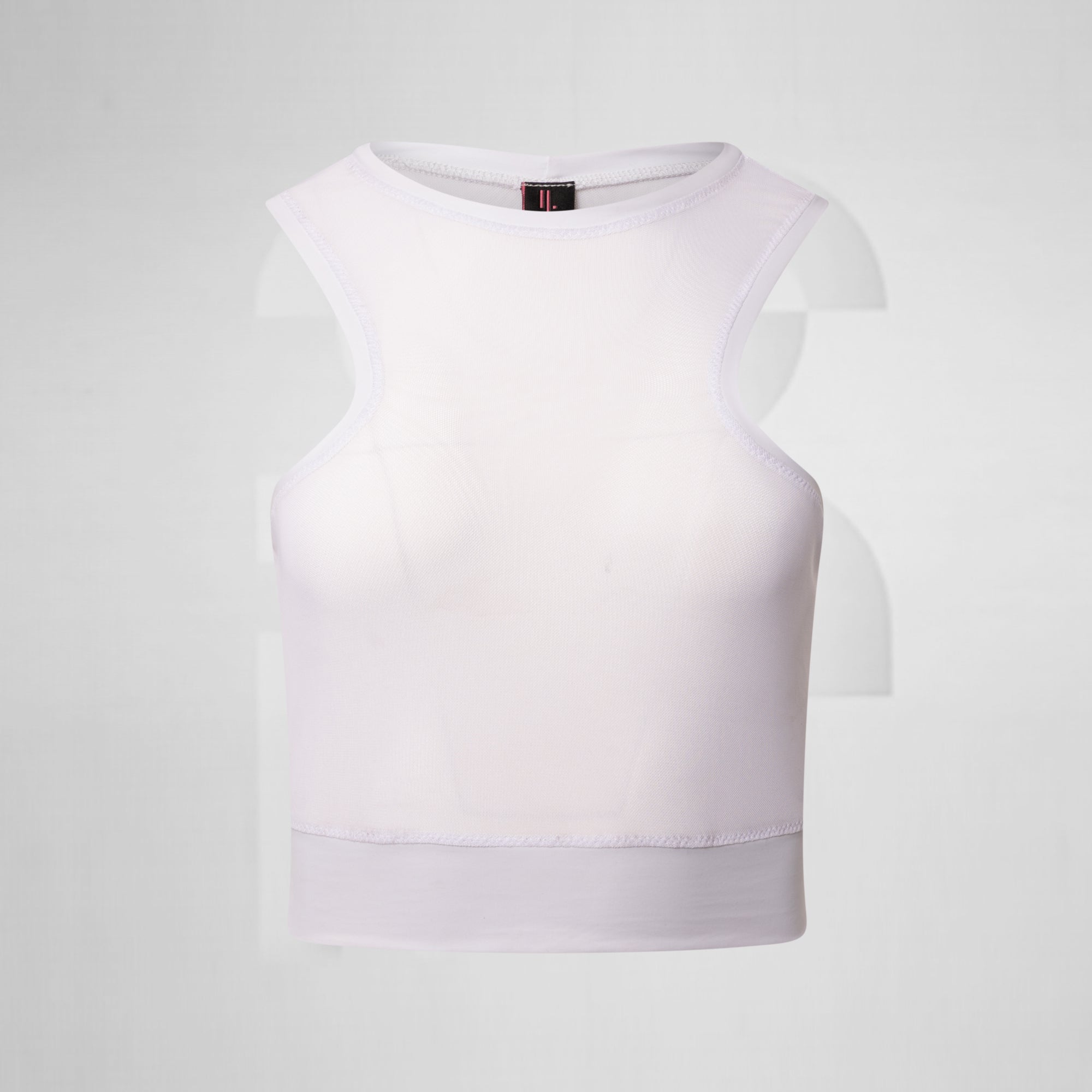 White mesh tank top in front of grey background