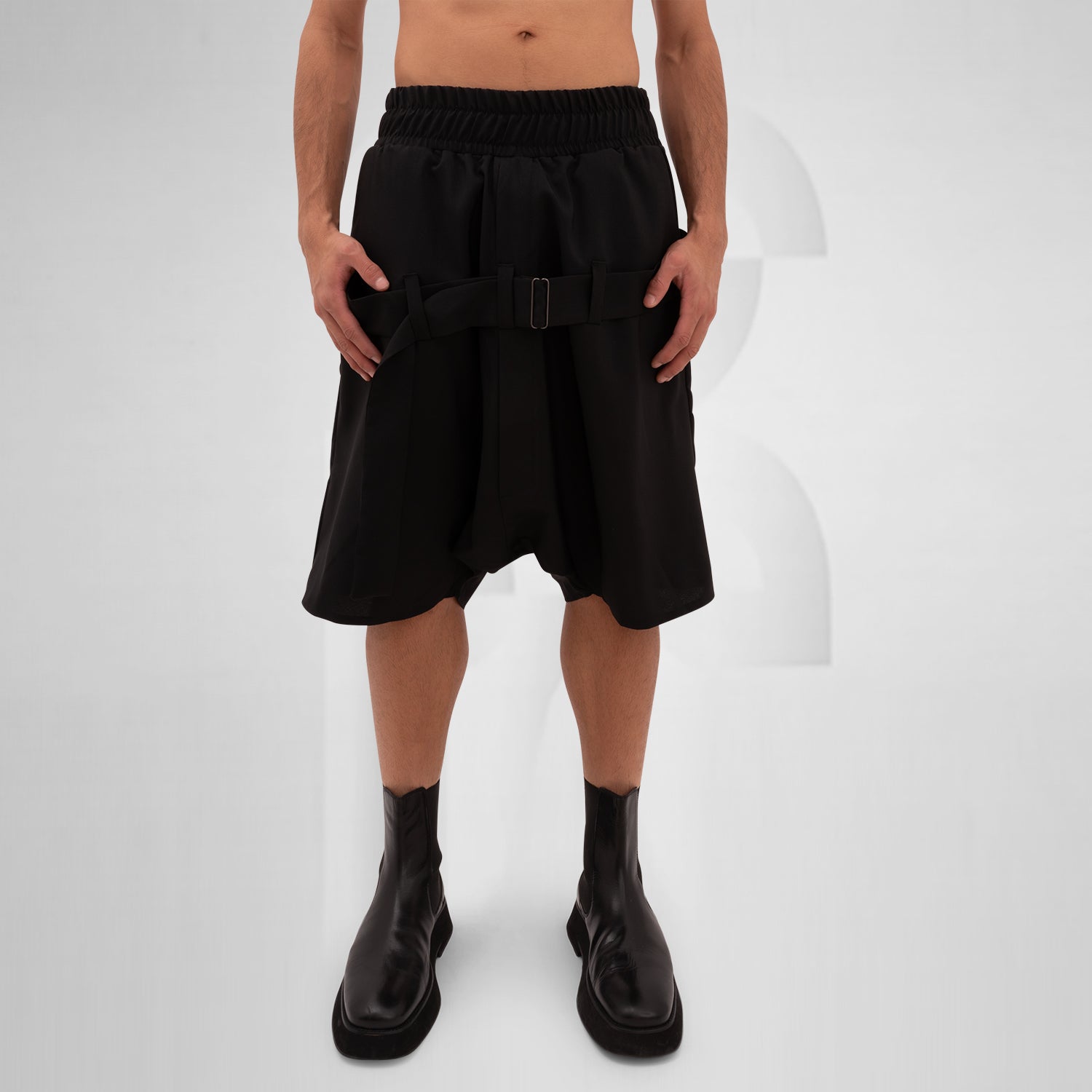 The Wide Shorts with Straps Mixed from This is Fred showcase a bold silhouette that blends avant-garde design with everyday practicality. Crafted from high-quality materials, these shorts feature adjustable straps that enhance both style and fit, allowing for a custom look that stands out in any ensemble. The unique shape adds a modern edge, while the thoughtfully placed pockets provide functionality without compromising aesthetics.
