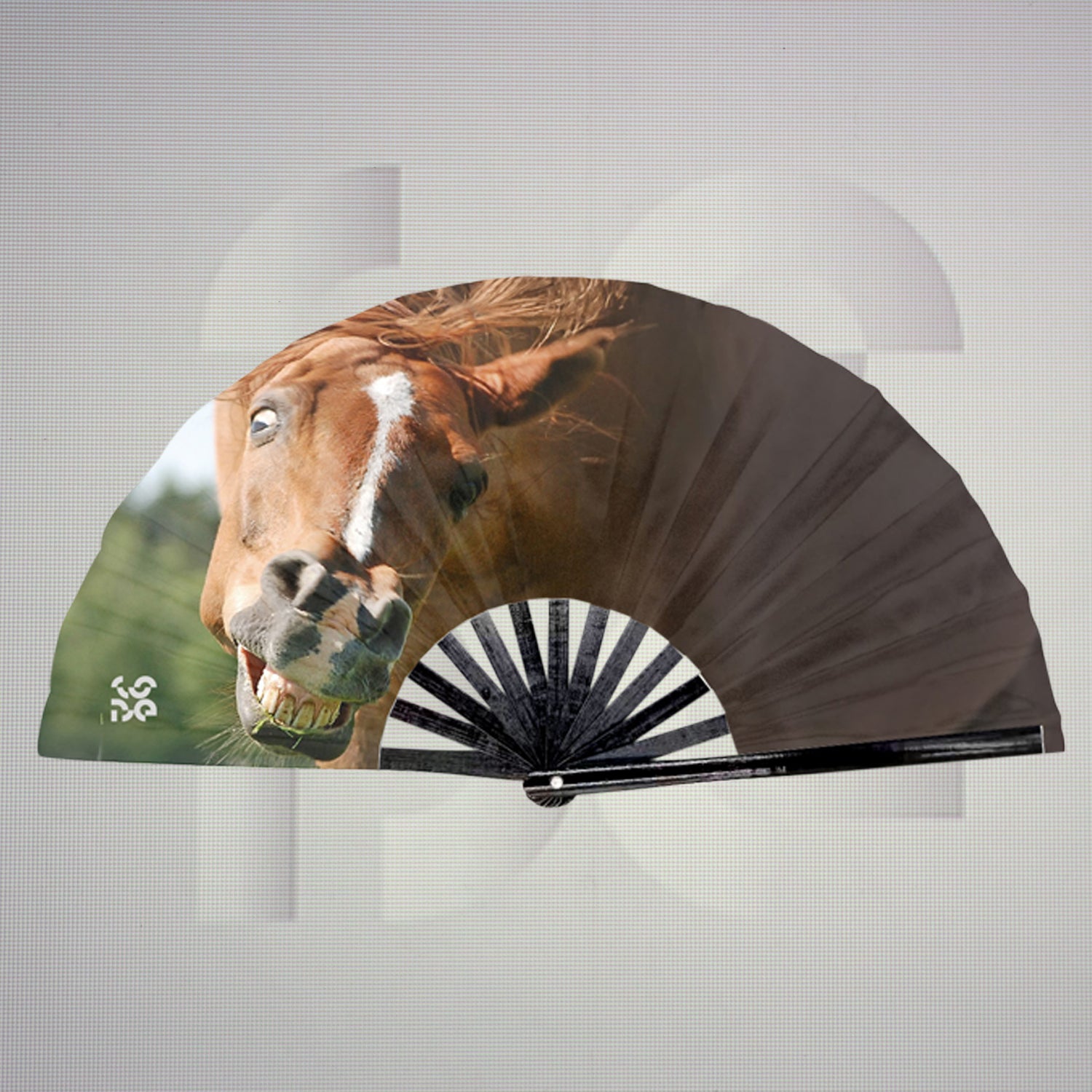 This is a folding fan featuring an image of a horse. The horse's face is prominently displayed, giving it a dynamic and expressive look. The fan combines artistic elements with a functional design.