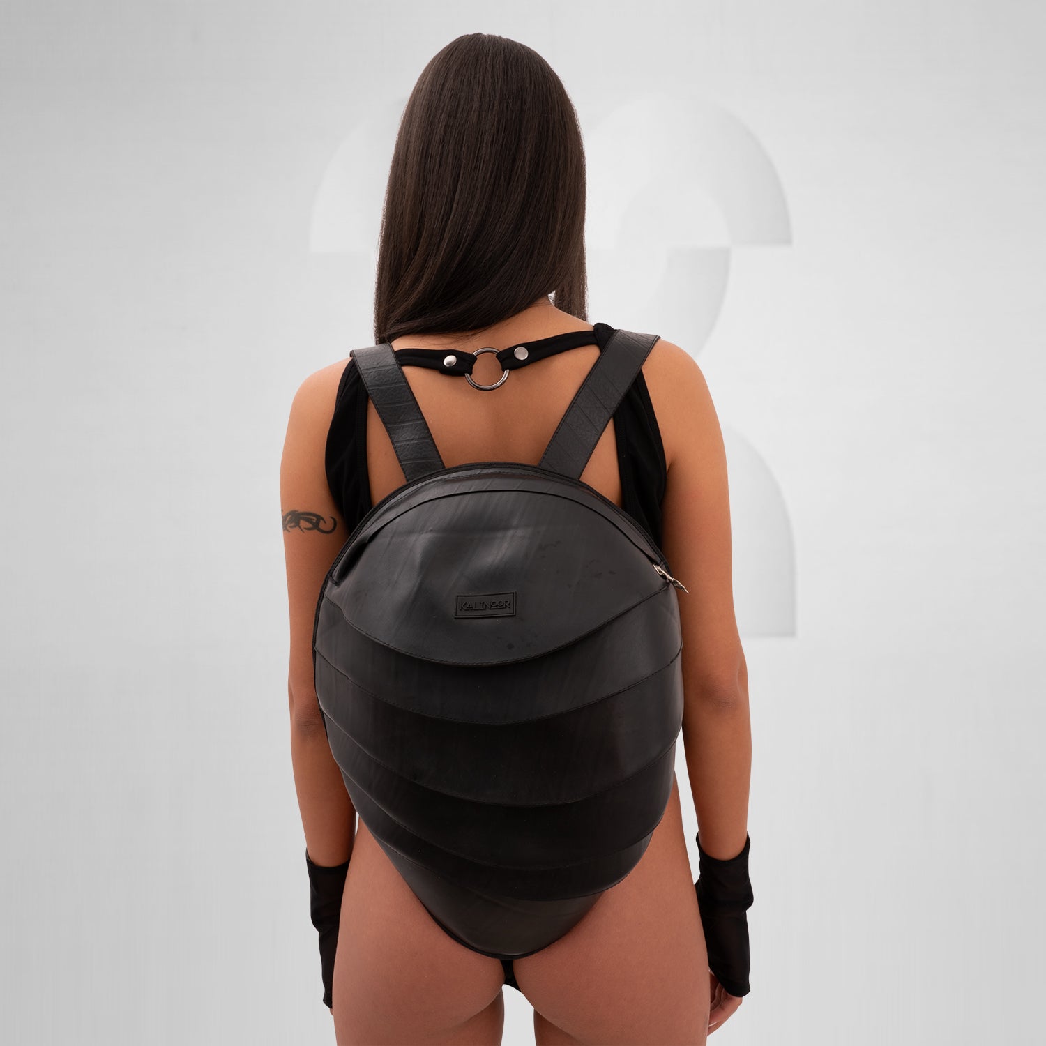 The faux Leather Anti-Spy Backpack - crafted from 100% recycled rubber, featuring a waterproof zipper, anti-spy pocket, and secret compartment.
