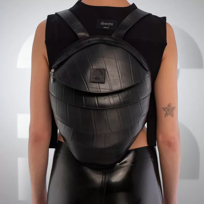 The faux Leather Anti-Spy Backpack - crafted from 100% recycled rubber, featuring a waterproof zipper, anti-spy pocket, and secret compartment.