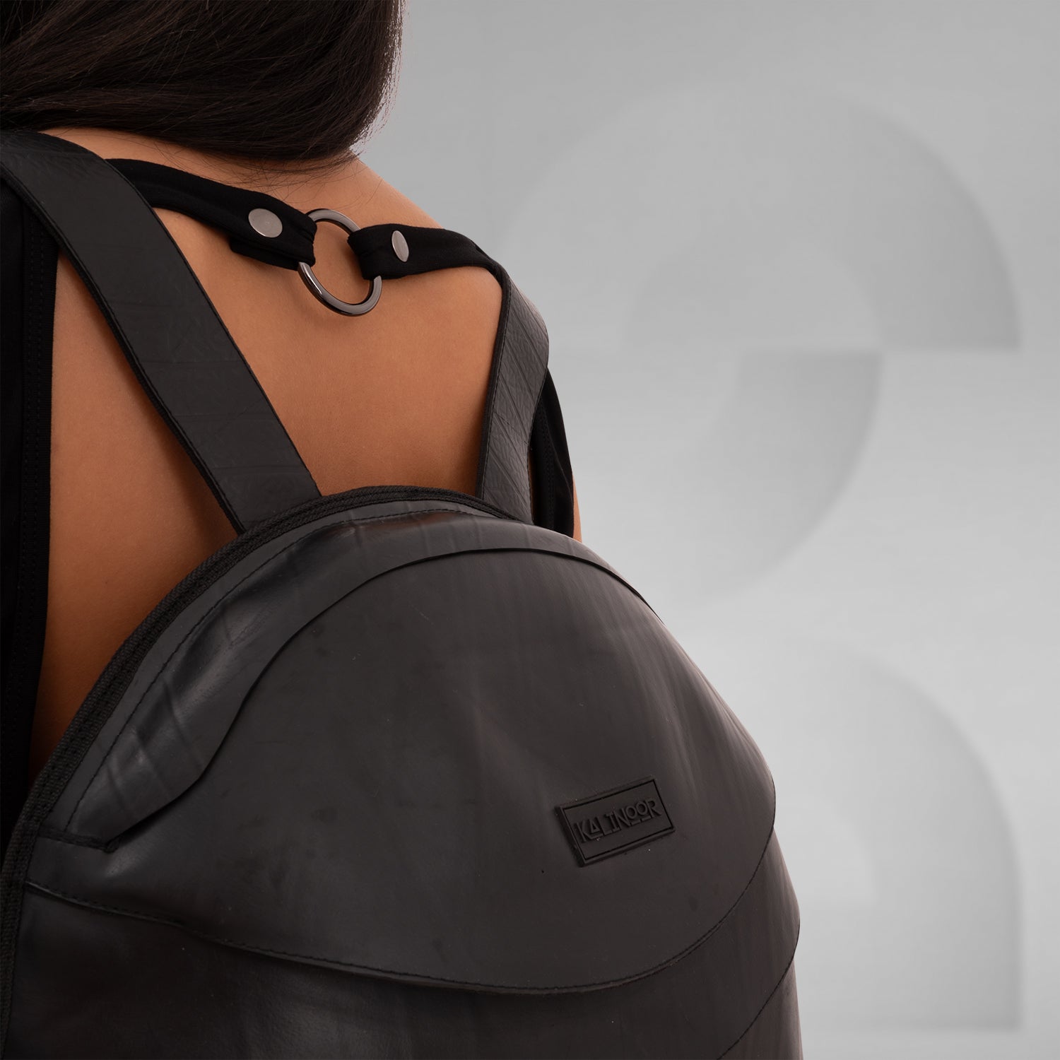 The faux Leather Anti-Spy Backpack - crafted from 100% recycled rubber, featuring a waterproof zipper, anti-spy pocket, and secret compartment.