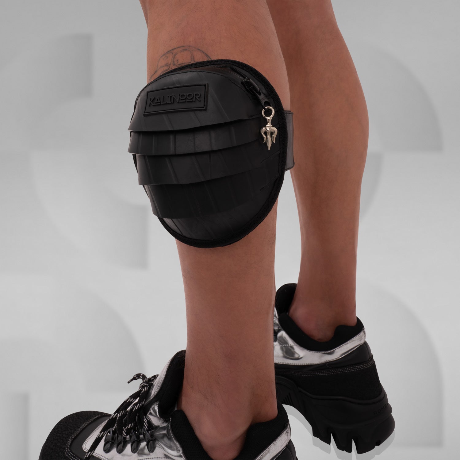 Recycled Rubber Arm & Leg Bag by Kalinoor made of 100% recycled rubber, waterproof zipper, hidden pocket, and adjustable arm and leg straps for ultimate versatility.