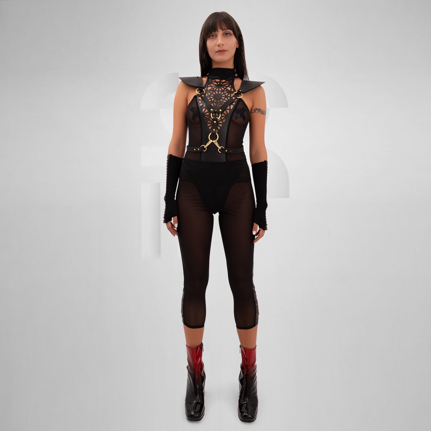 Sheer mesh leggings featuring a vegan laser-cut panel with a psychedelic pattern, designed for bold self-expression and perfect for festivals, nightlife, and avant-garde outfits.