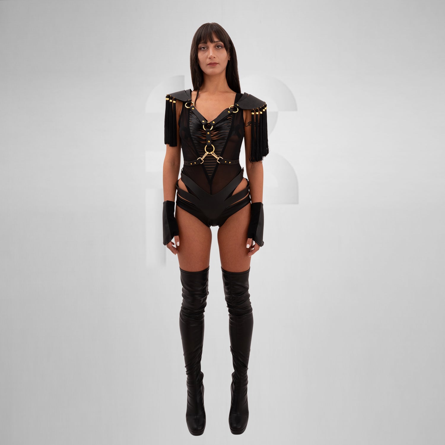 Vegan leather shoulder harness with flowing tassels and gold bead details, inspired by ancient warriors and celestial aesthetics. Adjustable straps for an empowering, mystical fit.