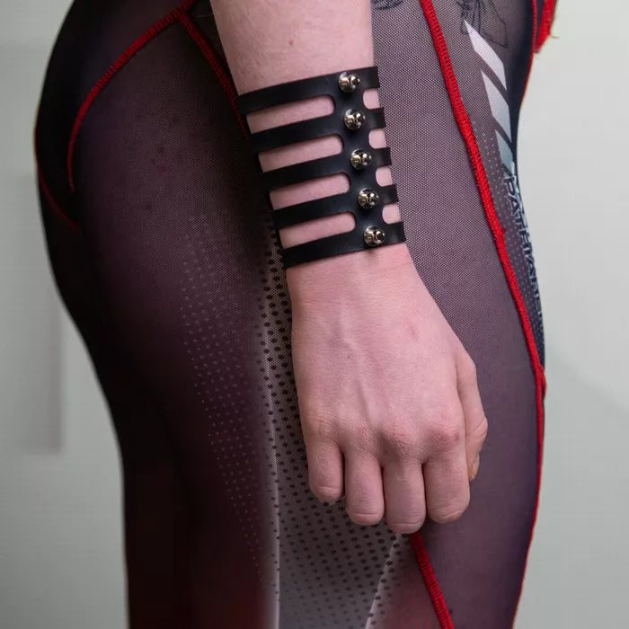 Rule the night with the leather handcuff with studs.