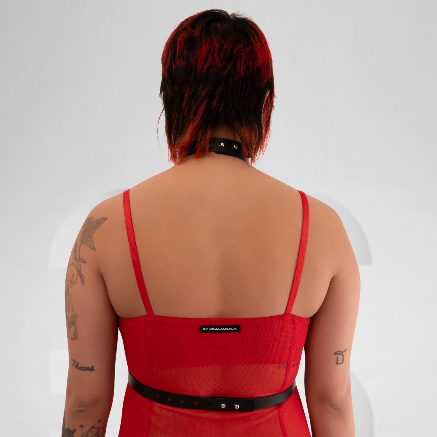 faux leather harness sculpting the body in avantgarde clubwear style