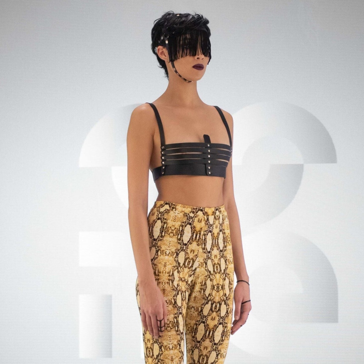 The faux leather fringe head harness, crafted for those who dare to defy the ordinary and embrace their unapologetic power.