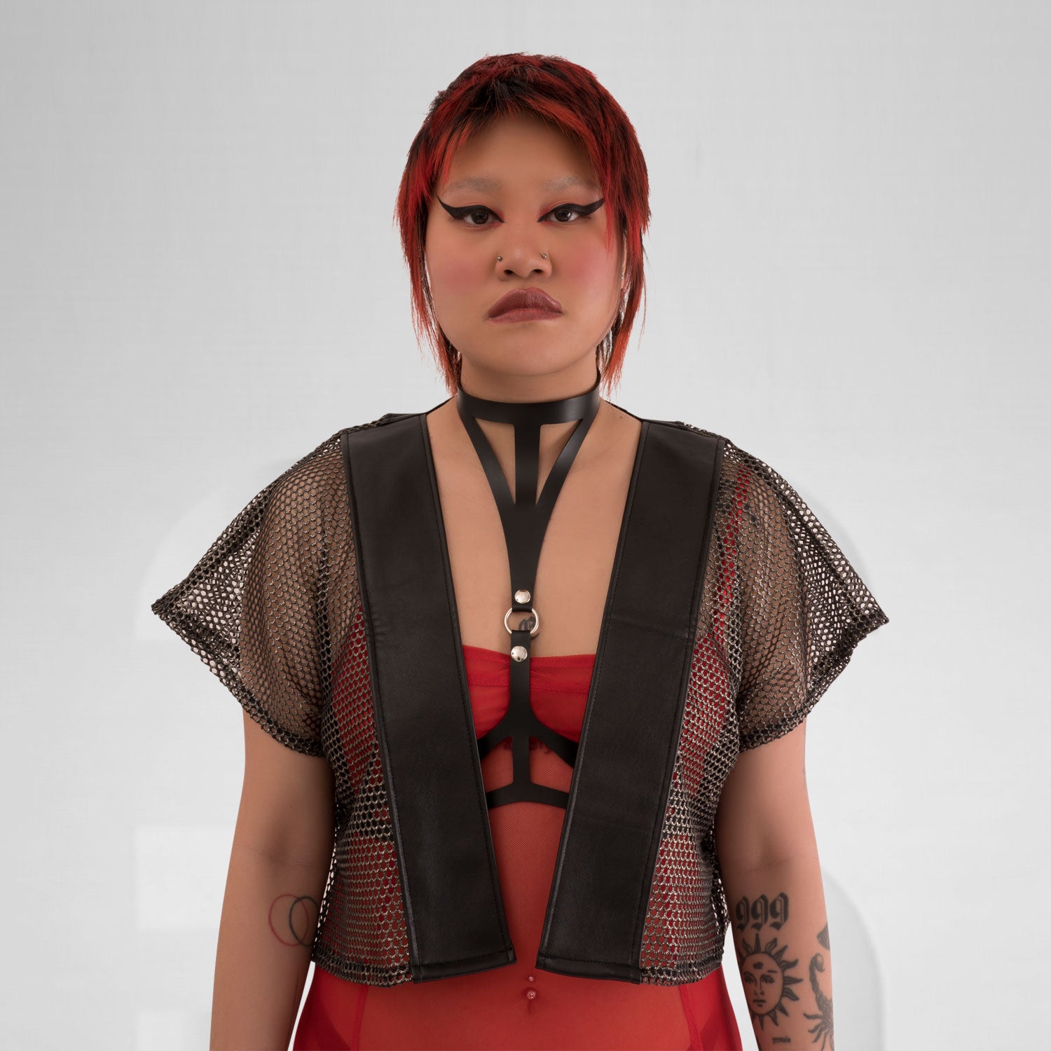 A stunning short gold kimono made of mesh fabric, showcasing avant-garde Berlin fashion.